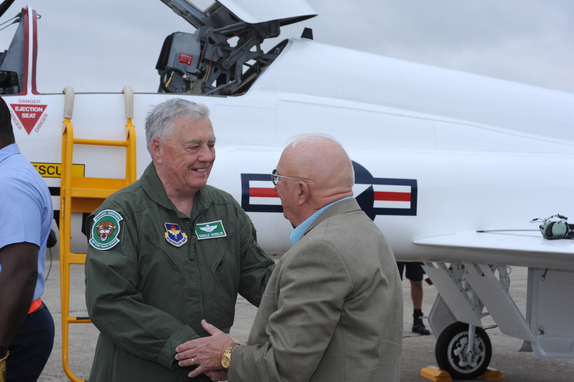 Retired Lt. Col. Donald Wheeler (left), a member of the first class to train in the T-38, reunites with retired Col. James Gibler, who was Colonel Wheeler's T-38 instructor in 1962, during a ceremony Thursday commemorating the 50th anniversary of the arrival of the T-38 at Randolph.  The two had not seen each other in 49 years.    (U.S. Air Force photo/Rich McFadden)