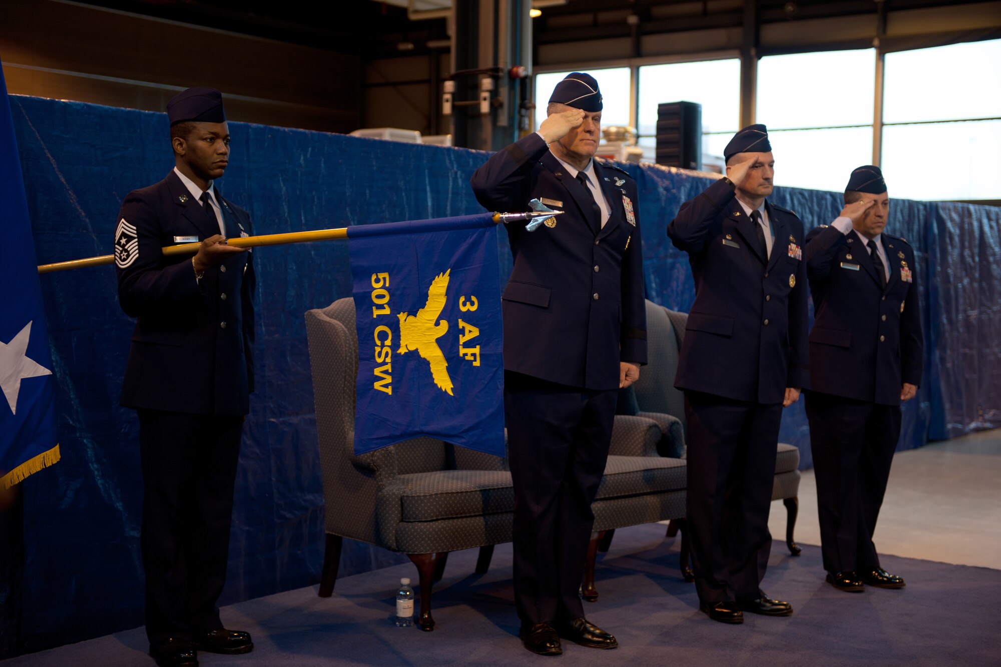 RAF ALCONBURY, United Kingdom - Command Chief Master Sgt. Laurence Kirby, Lt. Gen. Franc Gorenc, Col. Timothy Cashdollar and Col. Brian Kelly salute during the national anthem during a change of command ceremony March 17 at RAF Alconbury.  (U.S. Air Force photo by Tech. Sgt. John Barton)