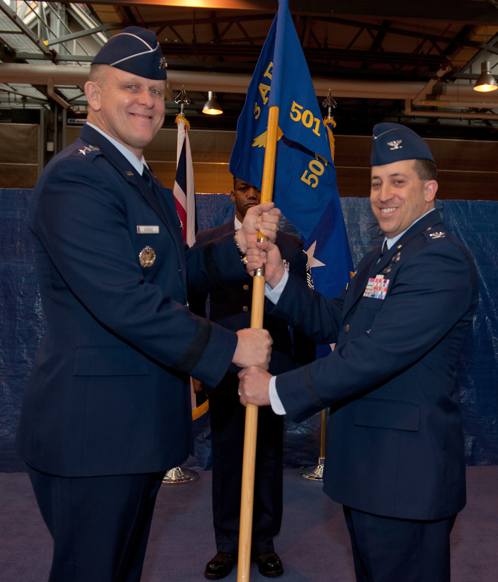 RAF ALCONBURY, United Kingdom - Col. Brian Kelly is given command of the 501st Combat Support Wing by Lt. Gen. Frank Gorenc after the passing of the guidon March 17 at RAF Alconbury. Prior to taking command, Colonel Kelly was the 31st Mission Support Group commander at Aviano Air Base, Italy. General Gorenc, Third Air Force commander, presided over the ceremony. (U.S. Air Force photo by Tech. Sgt. John Barton)