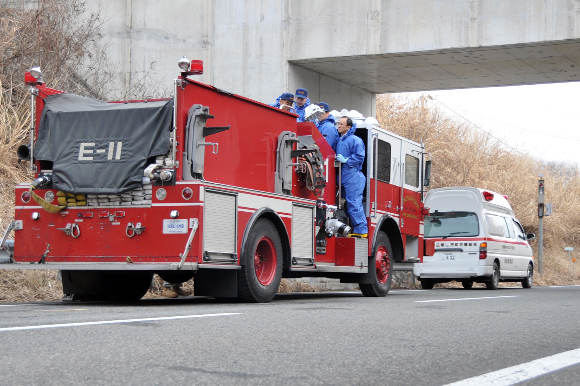 Japanese firefighters in Fukushima examine the control systems on a fire truck March 15, 2011, delivered to them from Yokota Air Base, Japan. The truck will be used to assist with recovery efforts in northern Japan following the earthquake and tsunami March 11. (U.S. Air Force/Airman 1st Class Andrea Salazar) 
