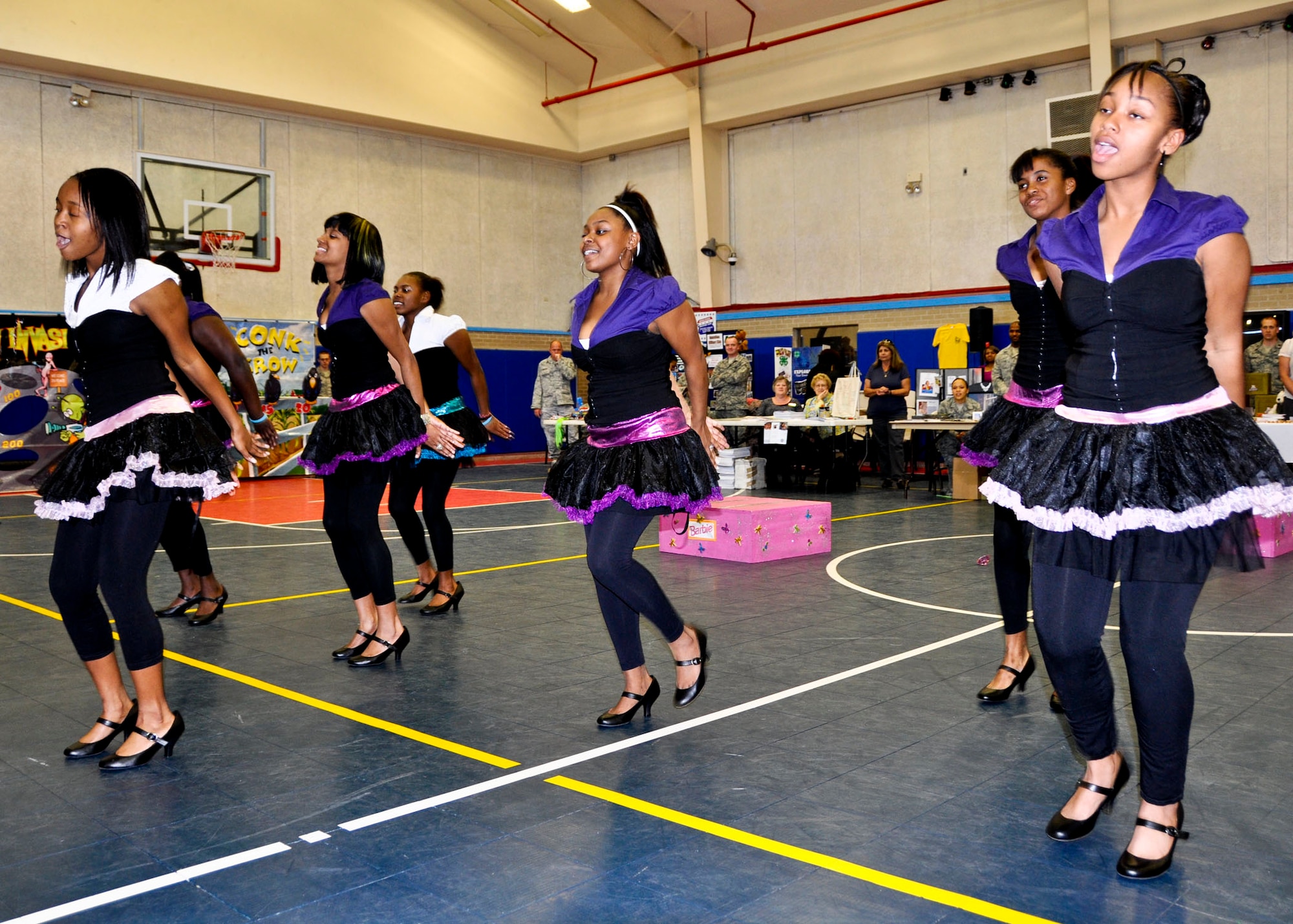 The Choctaw High School Step Team puts on a high-energy performance for the crowd at the “Because We Care” program at the Eglin Youth Center gym March 16.  The event featured activities and information for children who have or will have a military parent deployed in 2011.  (U.S. Air Force photo/Kevin Gaddie)