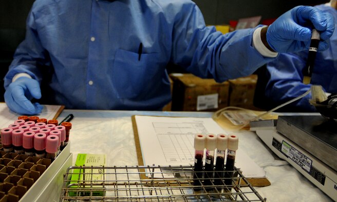 WHITEMAN AIR FORCE BASE, Mo. -- Vials of blood are separated and organized during an Armed Services Blood Program blood drive March 16, 2011. The blood collected will be used to care for deployed forces. (U.S. Air Force photo by Senior Airman Kenny Holston)(Released)


