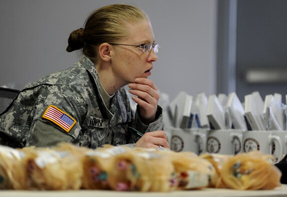 WHITEMAN AIR FORCE BASE, Mo. -- A U.S. Army Specialist working with the Armed Services Blood Program takes donors information prior to them donating blood March 16, 2011. Members of the ASBP drew blood from several donors and ensured a smooth transaction. The blood collected will be used to care for deployed forces. (U.S. Air Force photo by Senior Airman Kenny Holston)(Released)


