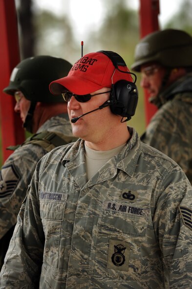MOODY AIR FORCE BASE, Ga. -- Tech. Sgt. Russell Quattrocchi, 23rd Security Forces Squadron combat arms instructor, observes Moody members as they shoot in multiple positions at the Combat Arms Training and Maintenance range Feb. 11. Sergeant Quattrocchi helped ensure the different shooting positions were correctly performed. (U.S. Air Force photo/Airman 1st Class Douglas Ellis)(RELEASED)
