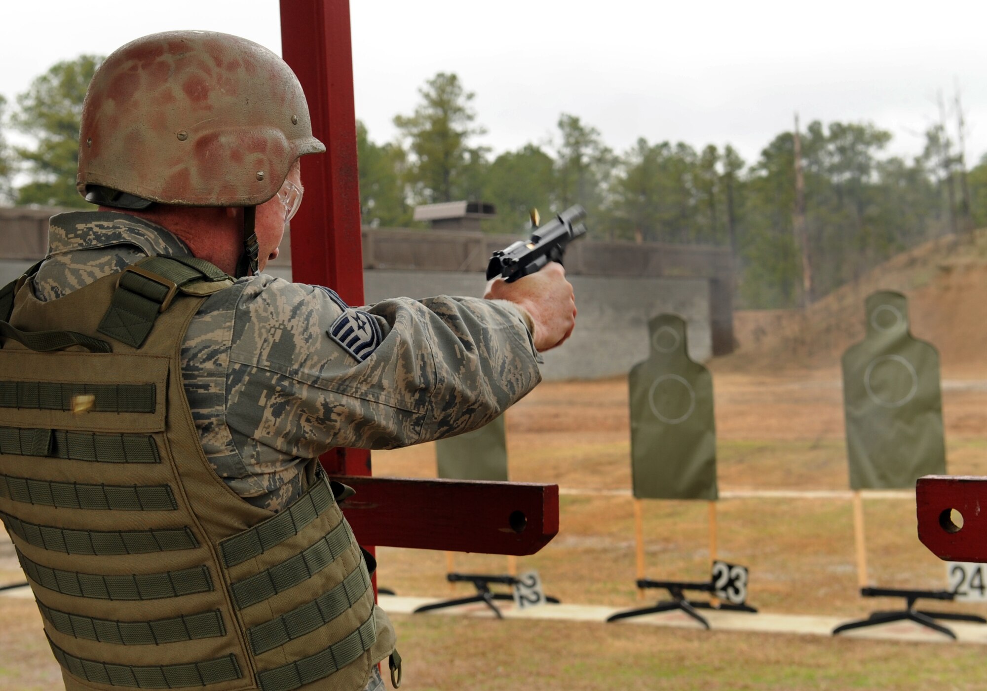 MOODY AIR FORCE BASE, Ga. -- Tech. Sgt. Patrick Hyde, 23rd Wing Public Affairs acting superintendent, fires a Beretta M-9 at the Combat Arms Training and Maintenance range Feb. 11. A minimum score of 35 must be achieved to qualify. (U.S. Air Force photo/Airman 1st Class Douglas Ellis)(RELEASED)
