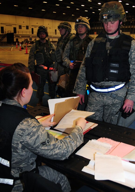 Airmen processes through a deployment line during a phase I operational readiness exercise at Ellsworth Air Force Base, S.D., March 15, 2011.  The exercise is designed to test the wing and its Airmen on their ability to deploy. (U.S. Air Force photo/Senior Airman Anthony Sanchelli)
