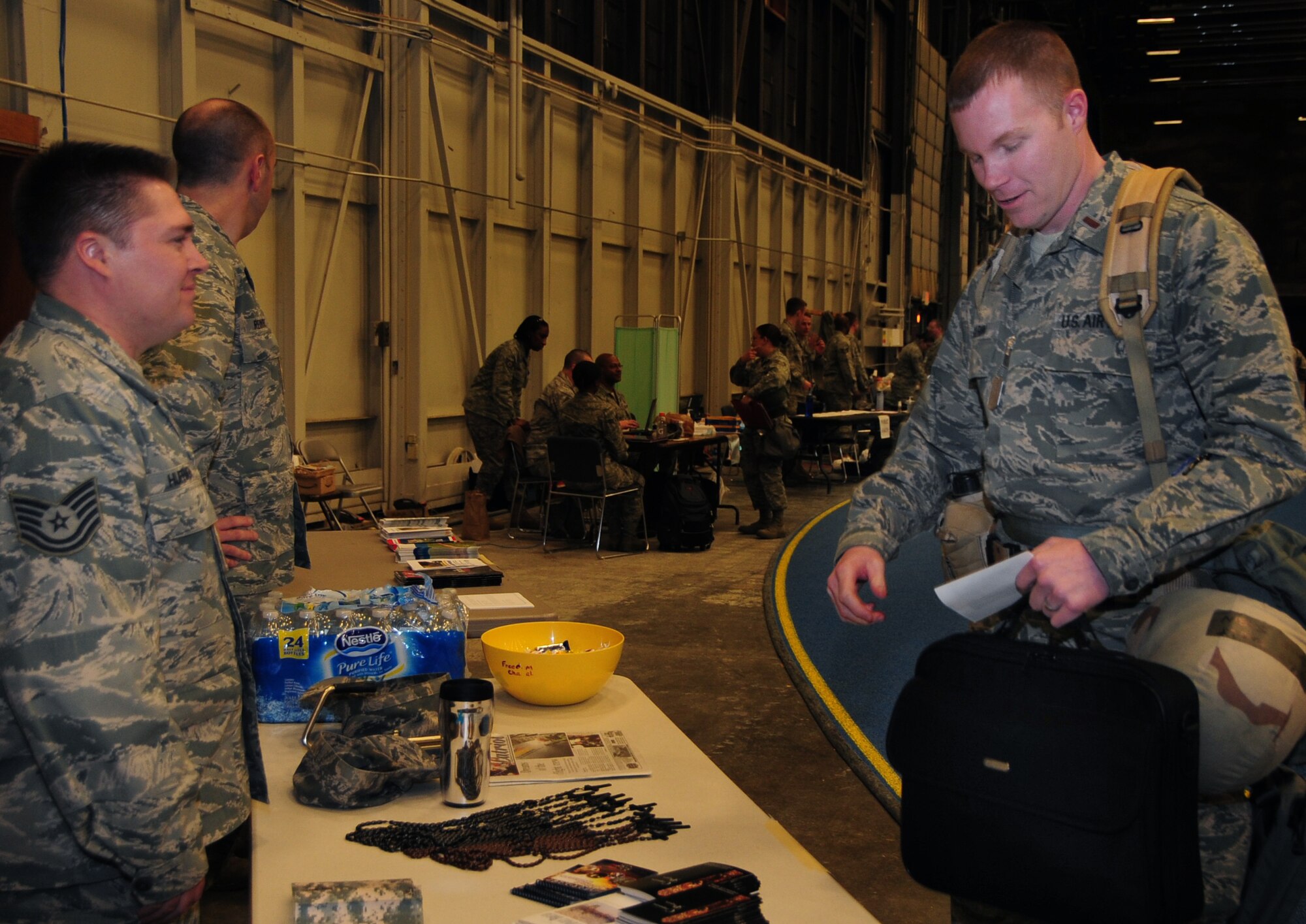 Second Lt. Jacob Sabin, 28th Contracting Squadron alpha troop commander, processes through a deployment line during a phase I operational readiness exercise at Ellsworth Air Force Base, S.D., March 15, 2011.  The exercise is designed to test the wing and its Airmen on their ability to deploy. (U.S. Air Force photo/Senior Airman Anthony Sanchelli)
