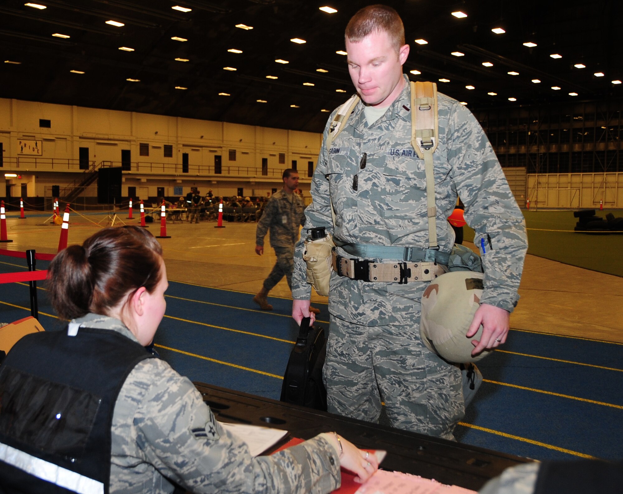 Second Lt. Jacob Sabin, 28th Contracting Squadron alpha troop commander, processes through a deployment line during a phase I operational readiness exercise at Ellsworth Air Force Base, S.D., March 15, 2011.  The exercise is designed to test the wing and its Airmen on their ability to deploy. (U.S. Air Force photo/Senior Airman Anthony Sanchelli)
