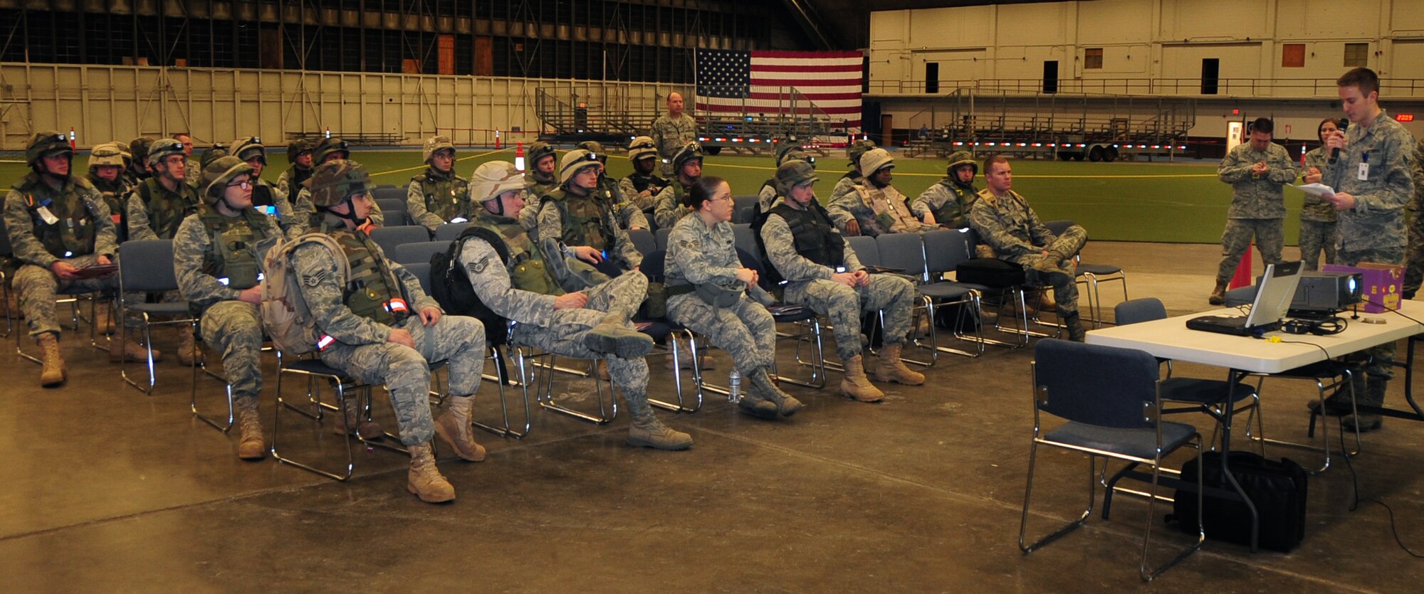Airmen listen to a deployment briefing during a phase I operational readiness exercise at Ellsworth Air Force Base, S.D., March 15, 2011.  The exercise is designed to test the wing and its Airmen on their ability to deploy. (U.S. Air Force photo/Senior Airman Anthony Sanchelli)
