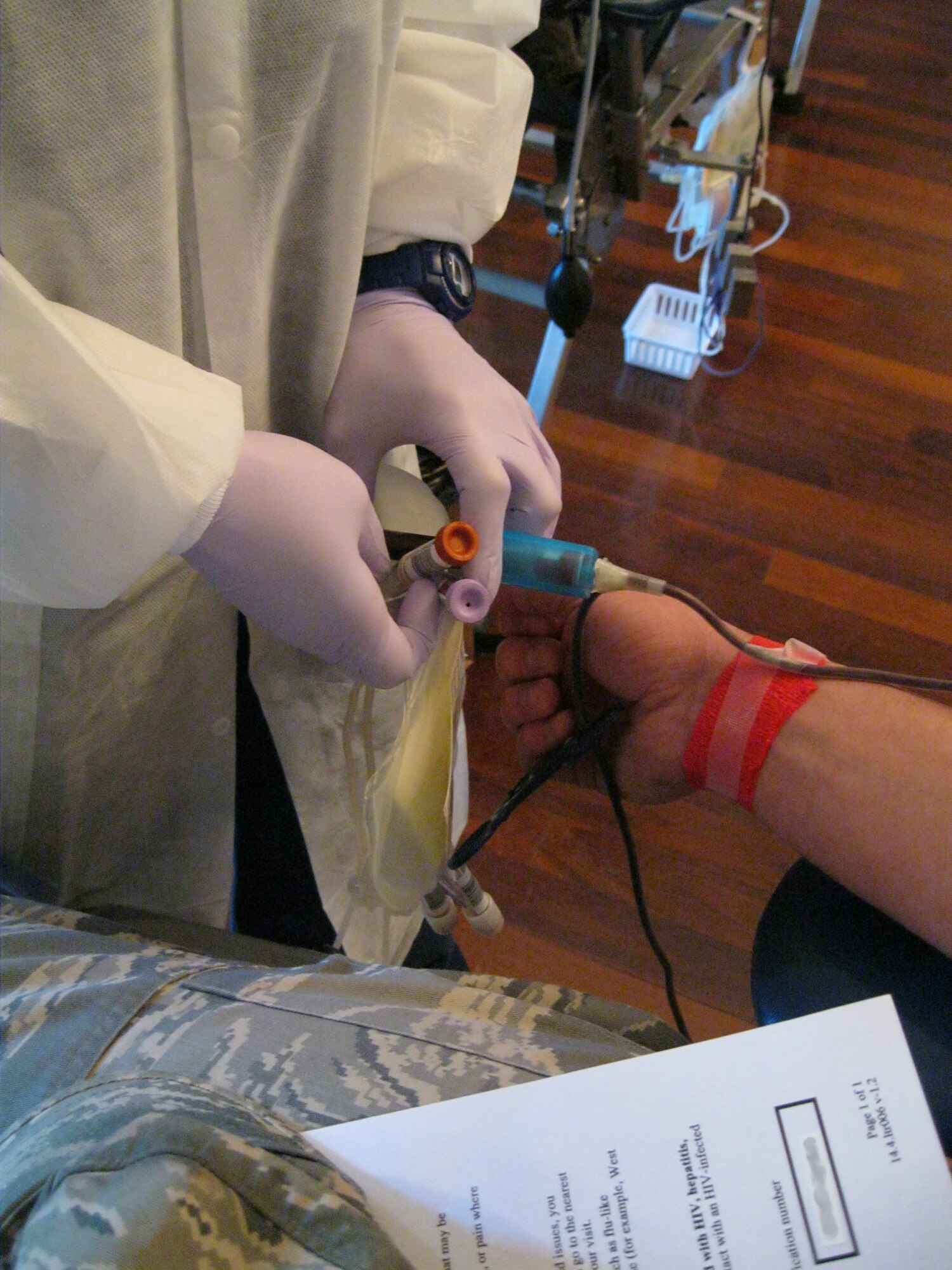 SEYMOUR JOHNSON AIR FORCE BASE, N.C. -- Linda Bain fills tubes with blood for processing during an American Red Cross blood drive here March 11, 2011. The ARC's more than 155,000 volunteers collect 6 million pints of blood annually. Ms. Bain is an ARC blood collection technician. (U.S. Air Force photo/Tech. Sgt. Tammie Moore) (RELEASED) 