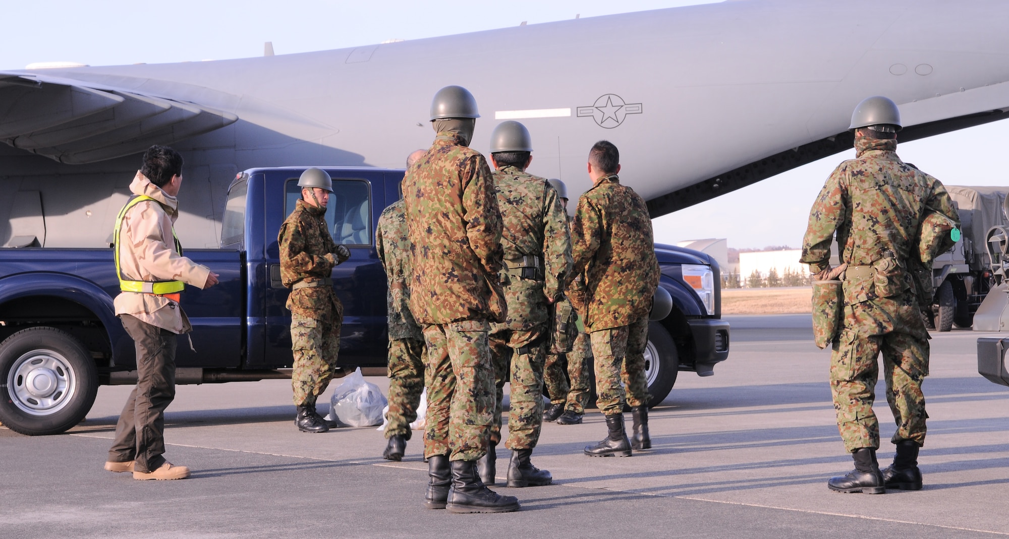 YOKOTA AIR BASE, Japan -- Japan Ground Self-Defense Force members arrive here from Okinawa, March 17. JGSDF will team up with US forces to provide support for Operation Tomodachi. (U.S. Air Force photo/Airman 1st Class Krystal M. Garrett)