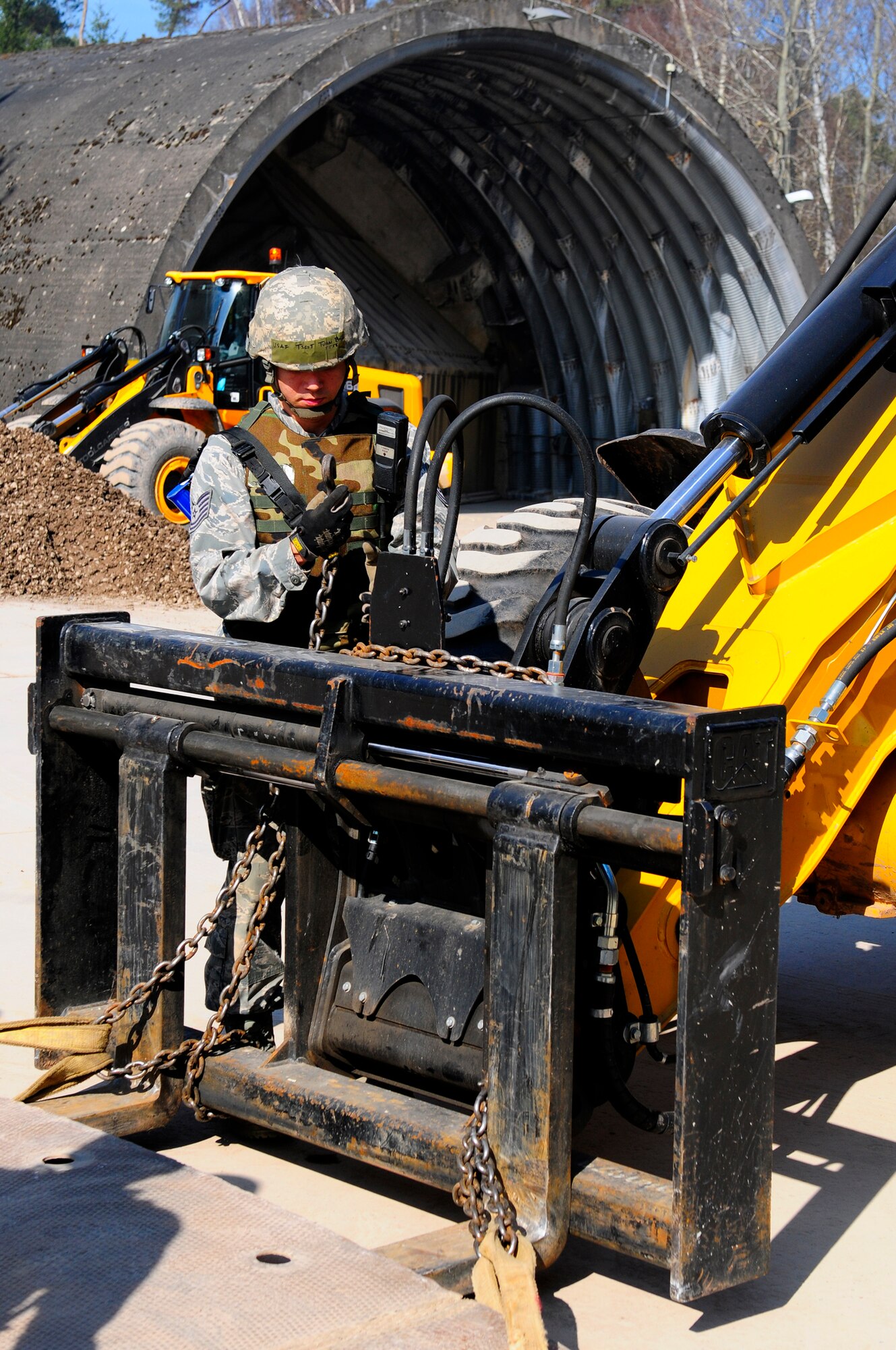 U.S. Air Force Tech. Sgt. Tuan Bui, 52nd Civil Engineer Squadron, prepares a fiber matte plate for placement during the Silver Flag exercise, Ramstein Air Base, Germany, March 15, 2011. Silver Flag is a weeklong training program that Airmen from all over the world participate in. Silver Flag combines classroom and practical application exercises to prepare airmen for deployment. (U.S. Air Force Photo by Airman 1st Class Brea Miller)


