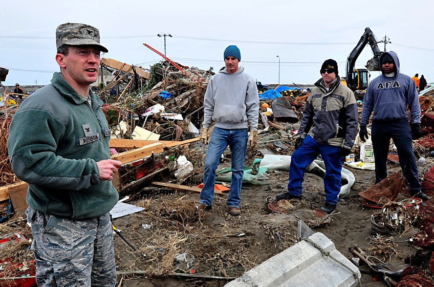 MISAWA AIR BASE, Japan -- Col. Michael Rothstein, 35th Fighter Wing commander, talks to Airmen at the Misawa City Port Mar. 15.  Fifty Airmen and Sailors volunteered their time to clean up the area when Misawa City asked for support. (U.S. Air Force photo by Staff Sgt. Marie Brown\Released)
