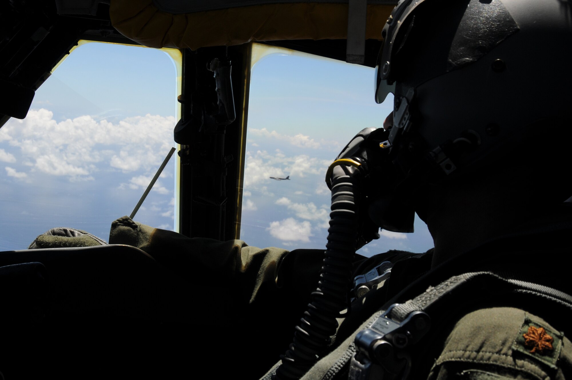 ANDERSEN AIR FORCE BASE, Guam- A instructor-pilot from the 69th Expeditionary Bomb Squadron, Minot Air Force Base, N.D., looks out the window at the other B-52?s in formation preparing to refuel in-flight. (U.S. Air Force photo/ Senior Airman Carlin Leslie)