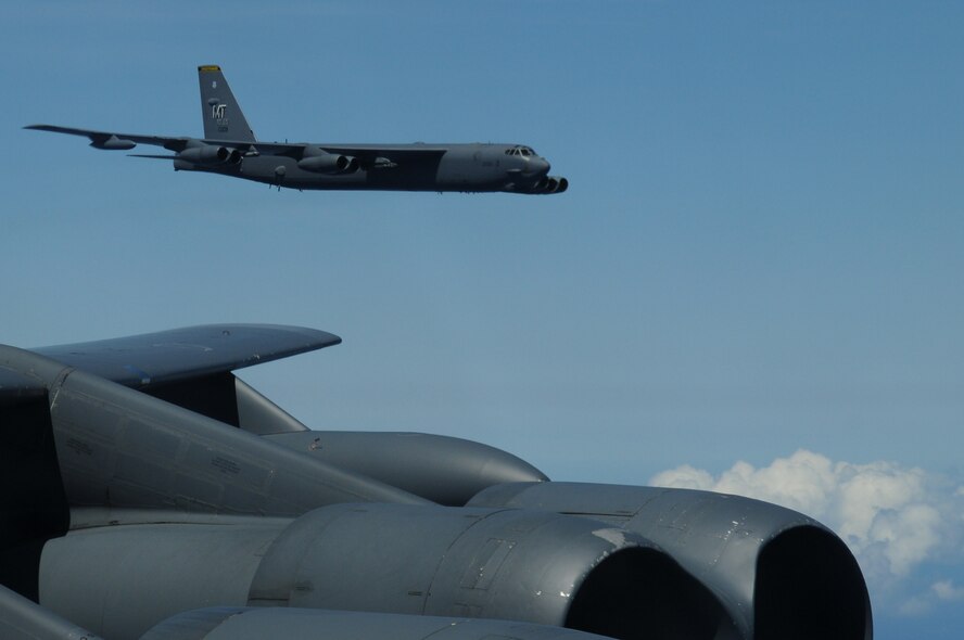 ANDERSEN AIR FORCE BASE, Guam- A B-52 Stratofortress from the 69th Expeditionary Bomb Squadron, Minot Air Force Base, N.D., is seen off the left wing while flying in formation with two other B-52's from Minot, March 15. The aircraft are conducting a training mission including a bomb run, in-flight refueling and navigation and radar scenarios.(U.S. Air Force photo/ Senior Airman Carlin Leslie)