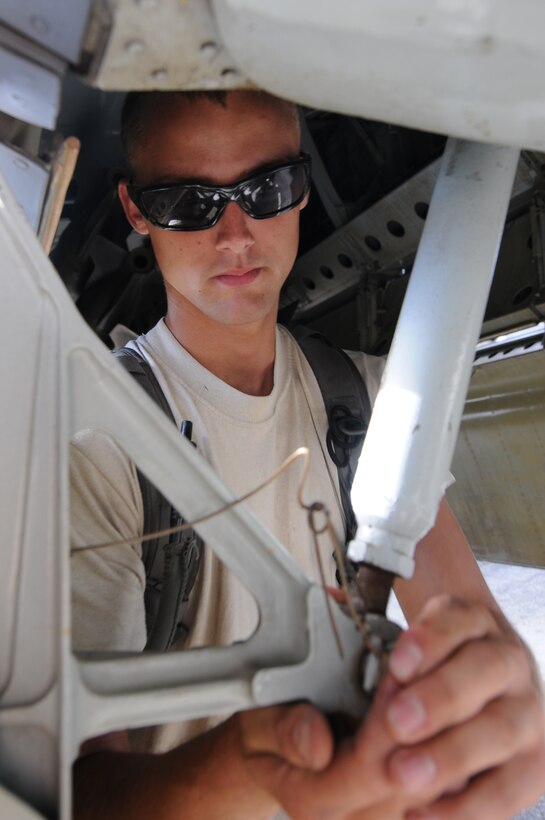 ANDERSEN AIR FORCE BASE, Guam- Senior Airman Kody Ealy, 69th Aircraft Maintenance Squadron crew chief, Minot Air Force Base, N.D., re-attaches the bomb bay door actuators on a B-52 Stratofortress from the 69th EBS, Minot Air Force Base, N.D., March 14. (U.S. Air Force photo/ Senior Airman Carlin Leslie)