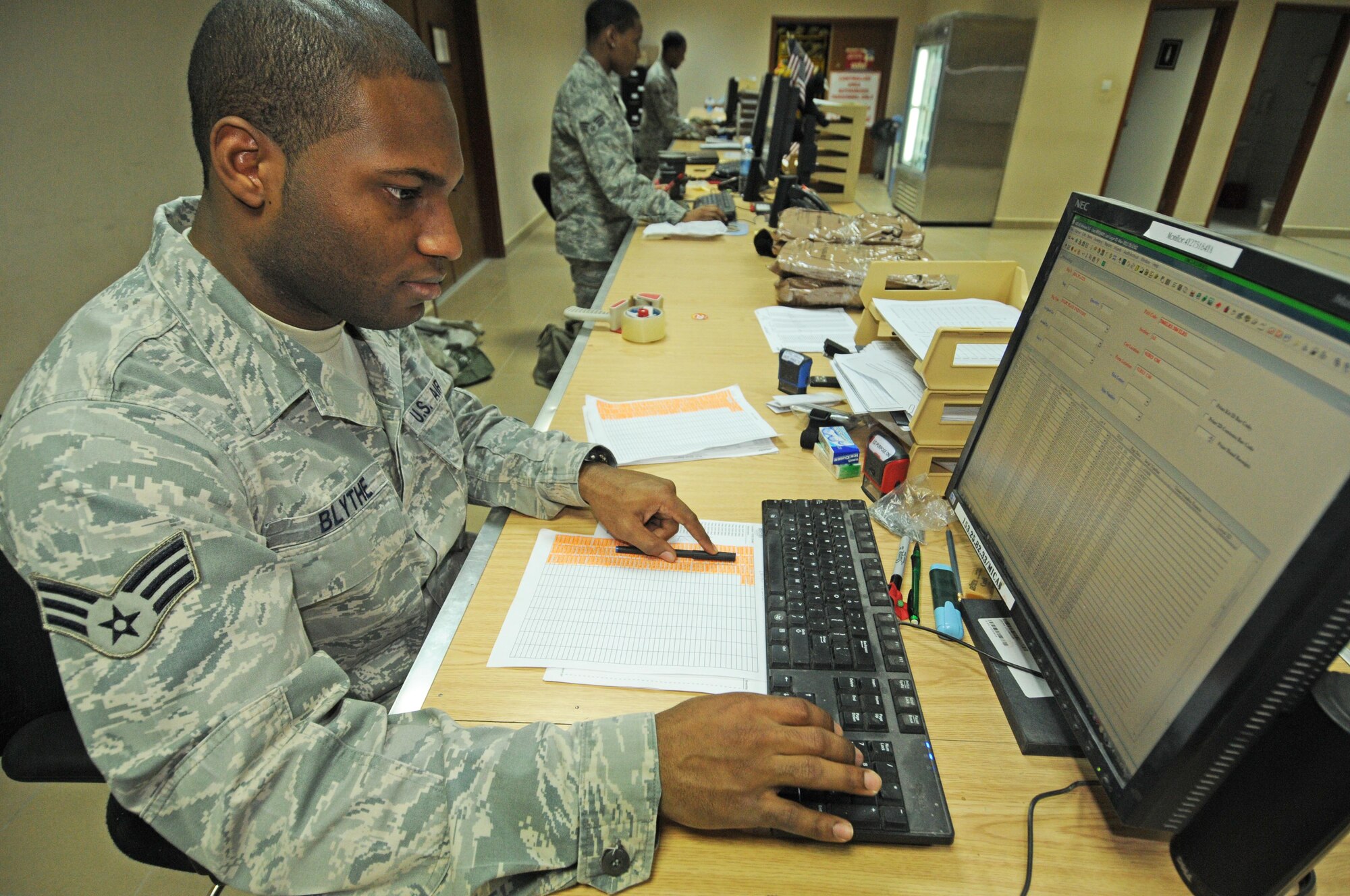 Senior Airman Kyle Blythe, 386th Expeditionary Logistics Readiness Squadron, checks equipment into the Mobility Inventory Control Accountability System at the 386th Expeditionary Theater Distribution Center here. The ETDC is one of three in the U.S. Air Force's Central Command Area Of Responsibility that provides a one-stop shop for individual body armor, chemical protective gear and weapons courtesy storage for forward deploying and transit members. (U.S. Air Force photo by Staff Sgt. Patrice Clarke)