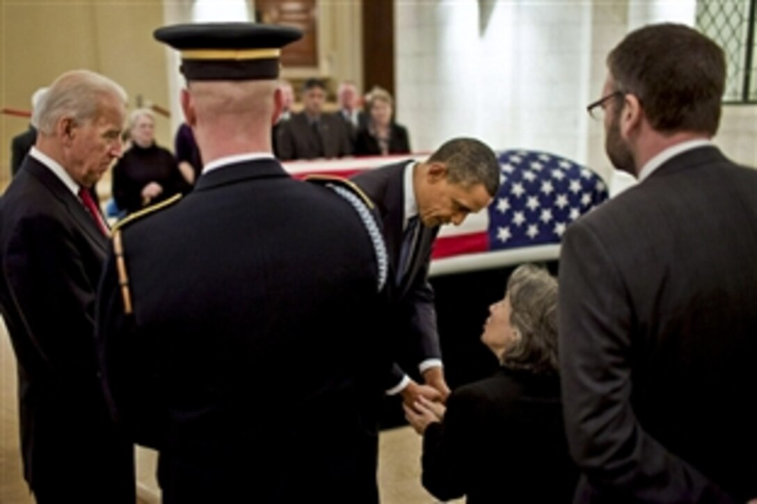 President Barack Obama and Vice President Joe Biden greet Susannah Flanagan, daughter of Frank Buckles, in the Memorial Amphitheater Chapel at Arlington National Cemetery in Arlington, Va., March 15, 2011. Buckles, the last American World War I veteran, died Feb. 27, 2011, at his West Virginia home. He was 110.