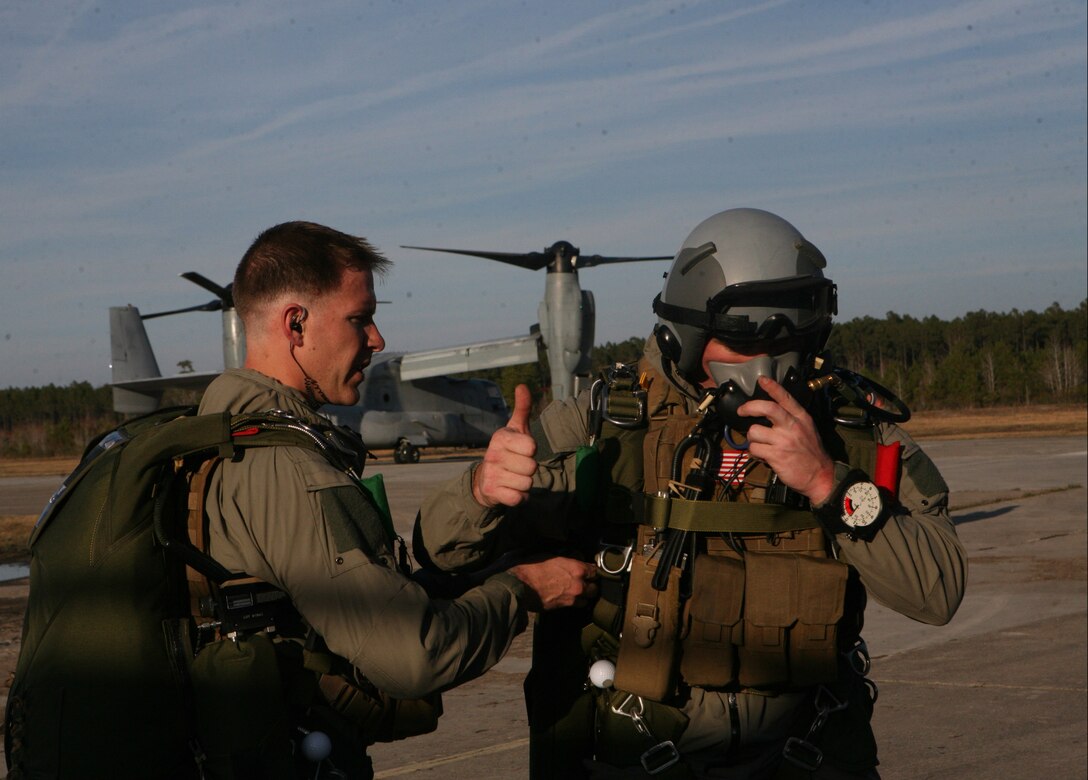 Marines with Force Reconnaissance Company, II Marine Expeditionary Force, check all of their gear before boarding an MV-22 Osprey aboard one of the training fields around Marine Corps Base Camp Lejeune, N.C., March 17, 2011. The Marines held the excercise in order to keep their free fall skills sharp.