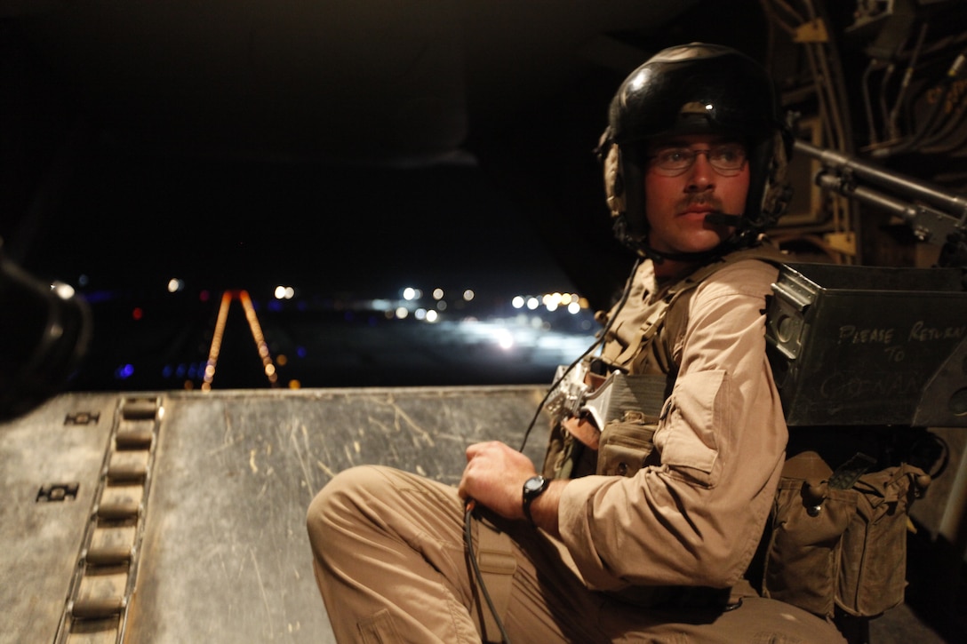 Sgt. Joseph W. Meccico, a crew chief with Marine Medium Tiltrotor Squadron 264, communicates with the flight crew of a MV-22B Osprey during takeoff from Camp Bastion, Afghanistan, in support of Operation Rawhide II, March 18. The initiative, Operation Rawhide II, is intended to interdict and disrupt enemy activity along the Pakistan border in anticipation of an expected spring offensive by insurgent forces.
