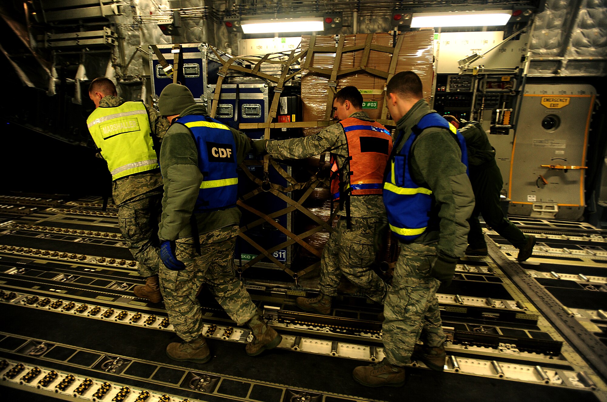 U.S. Air Force Aerial Porters from Misawa Air Base, Japan off load pallets of earthquake relief supplies from a C-17 III Globemaster on March 13, 2011 during  Operation Tomodachi. (U.S. Air Force photo by Master Sgt. Jeremy Lock) (Released)
