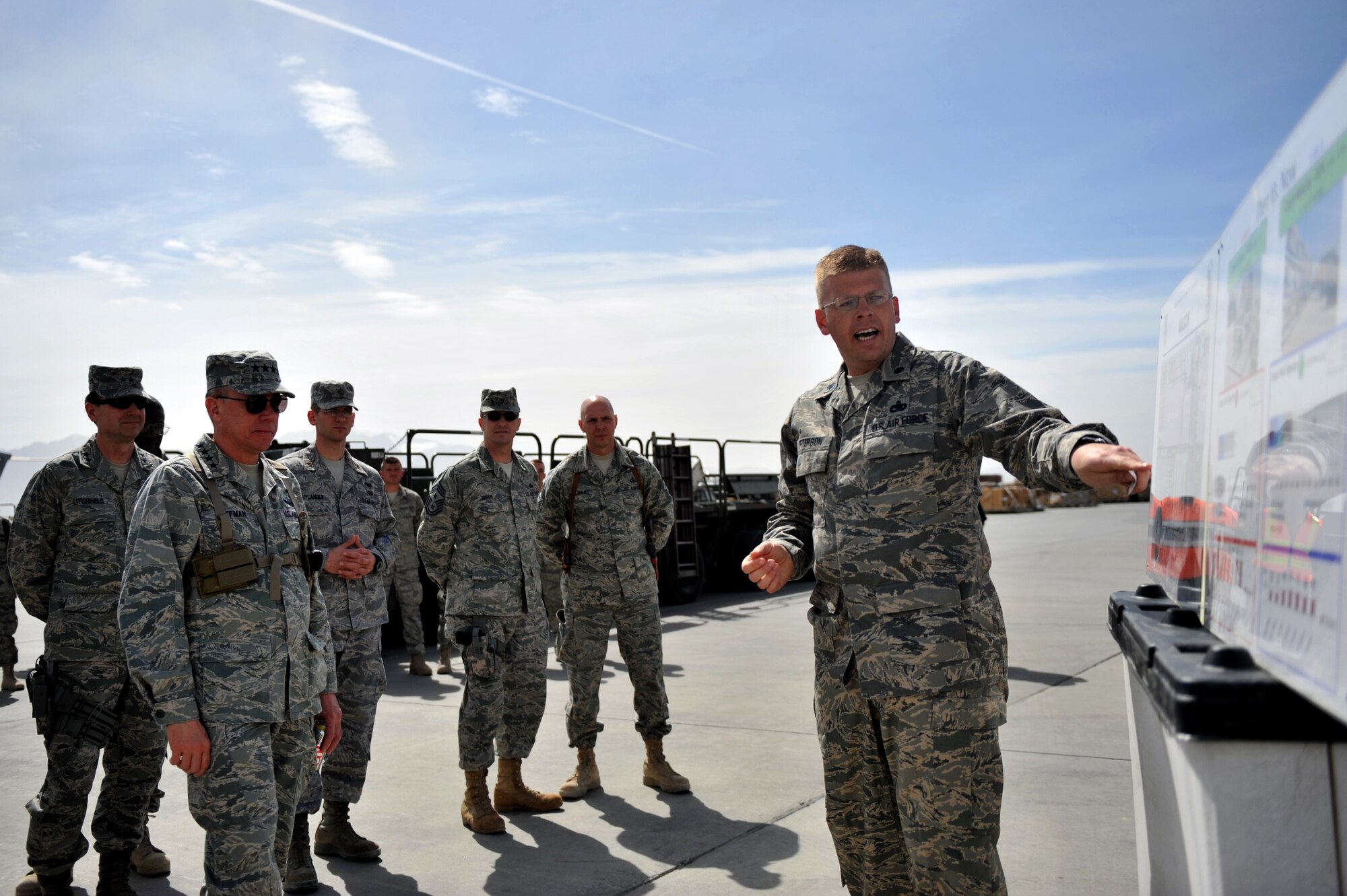 Lt. Col. Kirk Peterson, 455th Expeditionary Aerial Port Squadron commander, briefs Gen. Donald Hoffman, Air Force Materiel Command commander, during his visit at Bagram Airfield, Afghanistan, March 18, 2011. General Hoffman met and talked to deployed Airmen to determine how the command can better accomplish its supply and sustainment operations. (U.S. Air Force photo by Senior Airman Sheila deVera)
