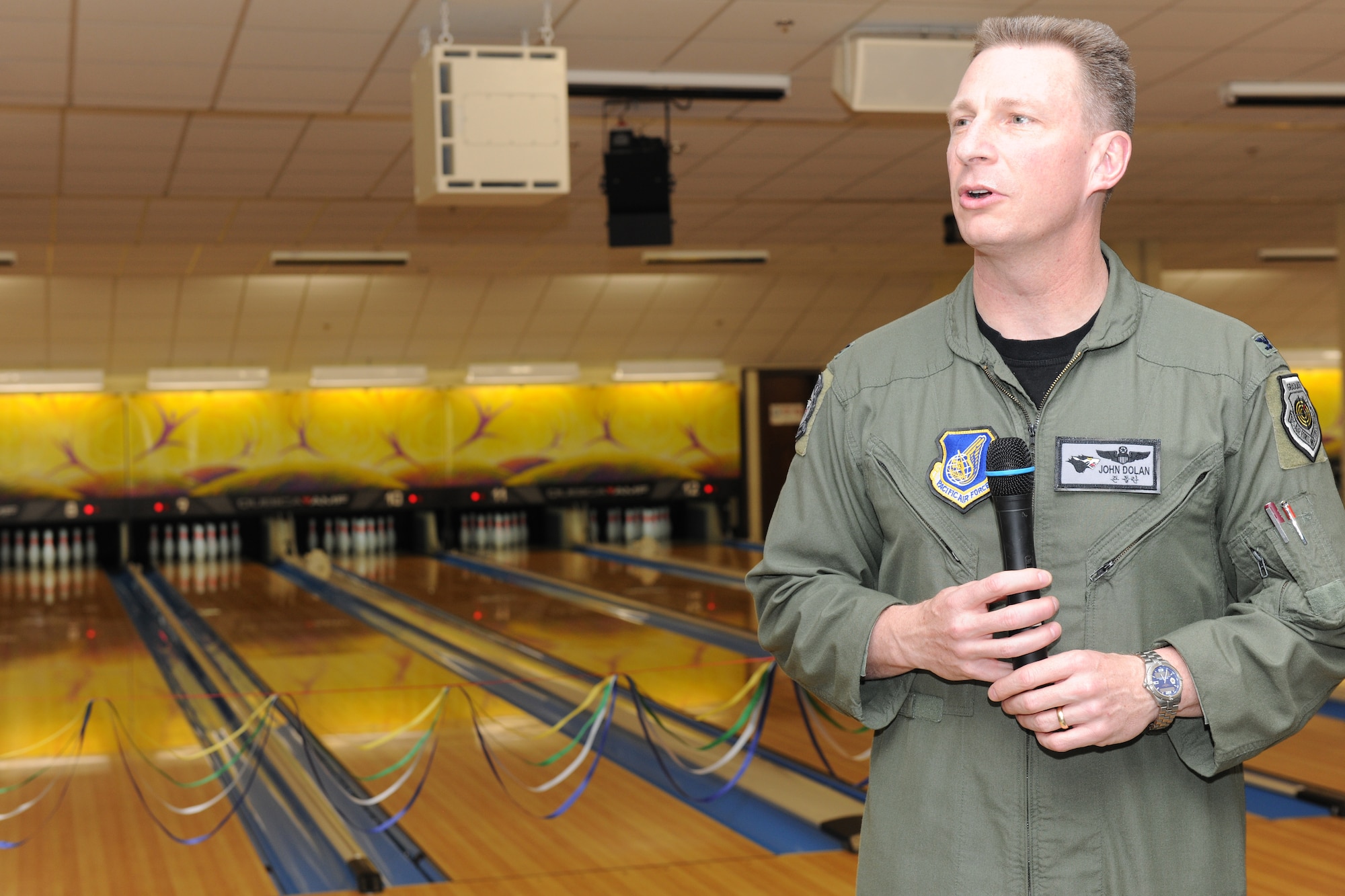 KUNSAN AIR BASE, Republic of Korea -- Col. John Dolan, 8th Fighter Wing commander, speaks at the grand opening of the Take It North bowling center.  The bowling center had been shut down for months while repairs were made to fix a collapsed roof.  (U.S. Air Force photo/Tech. Sgt. Jonathan Pomeroy) 
