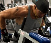 Staff Sgt. Ray Nealon, 735th Aircraft Maintenance Squadron crew chief, performs the "dip" exercise at the gym Mar. 3 at Joint Base Pearl Harbor Hickam. Patrons of the gym can utilize the weight room as well as other facilities including a basketball court, cardiovascular exercise machines and a smoothie store. (U.S. Air Force photo by Staff Sgt. Nathan Allen)