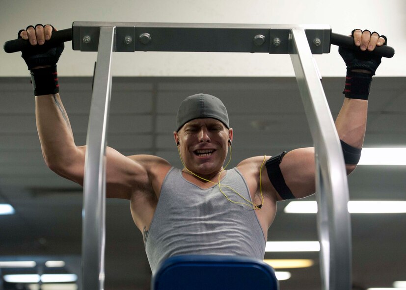 Staff Sgt. Ray Nealon, 735th Aircraft Maintenance Squadron crew chief, performs pull-ups at the gym Mar. 3 at Joint Base Pearl Harbor Hickam. Patrons of the gym can utilize the weight room as well as other facilities including a basketball court, cardiovascular exercise machines and a smoothie store. (U.S. Air Force photo by Staff Sgt. Nathan Allen)
