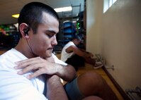 Two Air Force recruits perform sit ups at the gym Mar. 3 at Joint Base Pearl Harbor Hickam in preparation for their upcoming experience at basic military training at Lackland Air Force Base, Texas. Patrons of the gym can utilize the weight room as well as other facilities including a basketball court, cardiovascular exercise machines and a smoothie store. (U.S. Air Force photo by Staff Sgt. Nathan Allen)