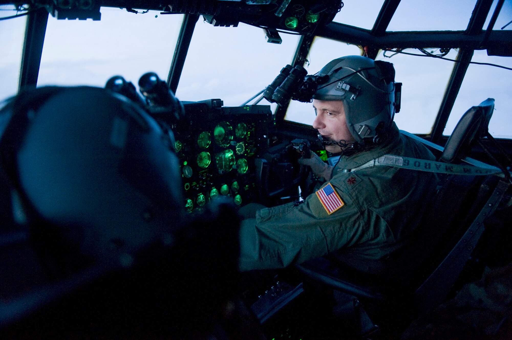 Maj. Kerry Redman flies March 16, 2011, during a supply-delivery mission to Sendai Airport, Japan. Major Redman is a pilot assigned to the 353rd Special Operations Group. (U.S. Air Force photo/Staff Sgt. Jonathan Steffen) 

