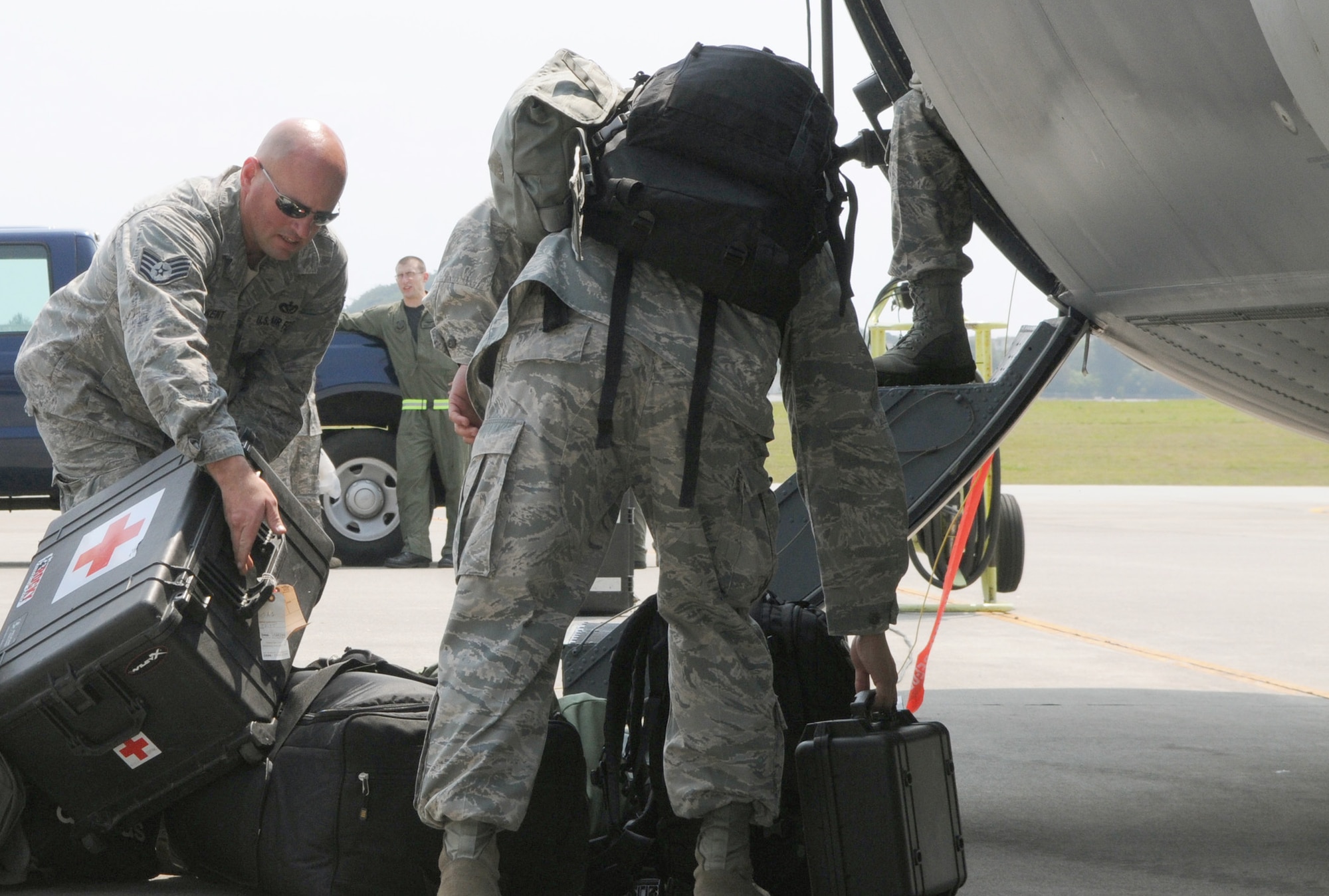 Airmen from the 353rd Special Operations Group load medical supplies and personal bags into a MC-130H Combat Talon II March 14, 2011, at Kadena Air Base, Japan. The aircraft is delivering additional equipment and support forces for the 353rd Special Operations Group forces deployed supporting humanitarian relief efforts at Yokota Air Base, Japan. (U.S. Air Force photo/Tech. Sgt. Aaron Cram) 
