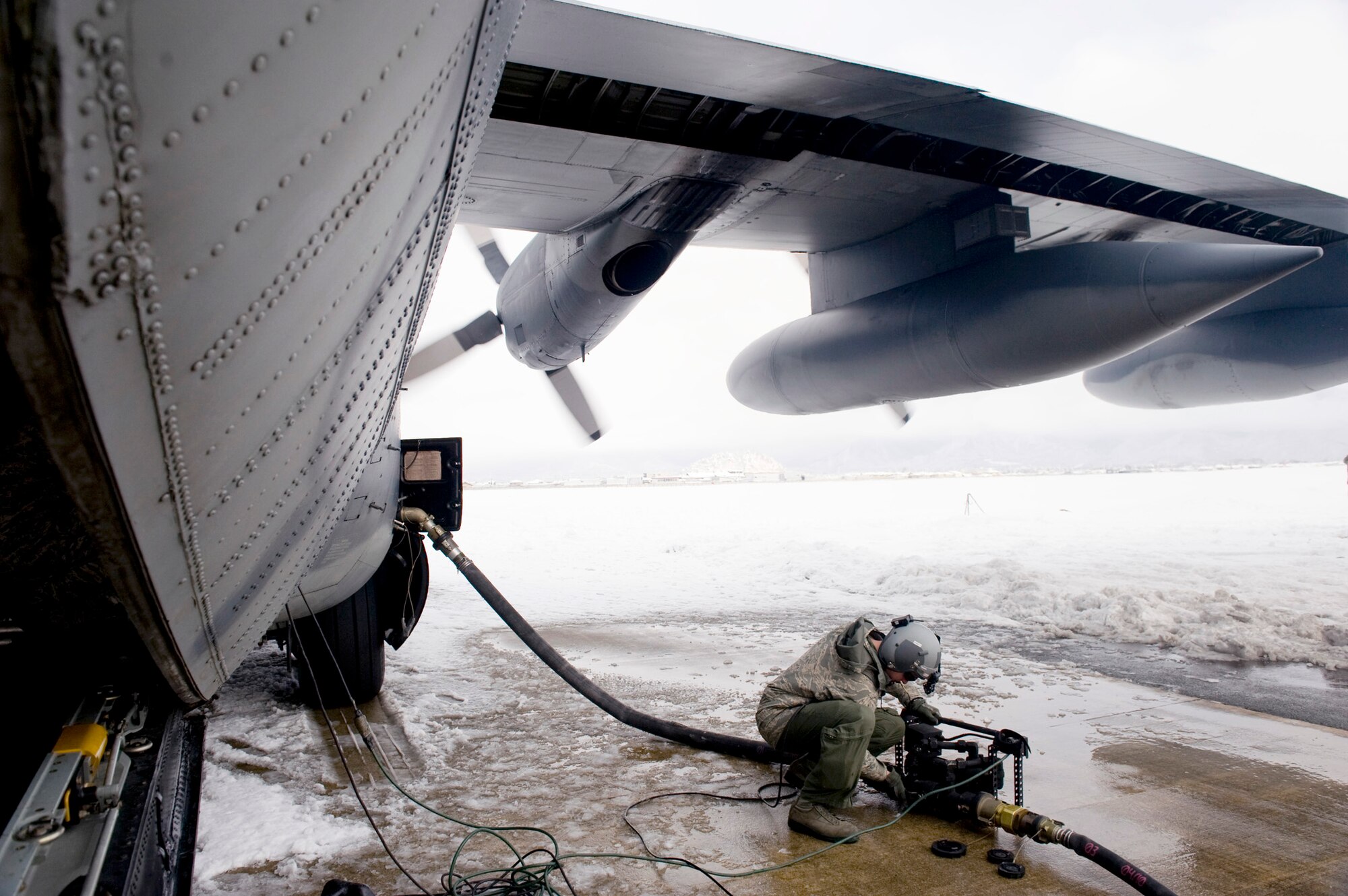 Staff Sgt. Nicholas Wisnoski, 17th Special Operations Squadron loadmaster, turns off a defueling pump for an MC-130P Combat Shadow March 17, 2011, at Yamagata Airport, Japan, during efforts to establish a forward area refueling point there. FARPs allow aircraft to operate at further distances by allowing the aircraft to refuel where no fuel typically exists. The fuel at Yamagata Airport will be used for American search-and-recovery teams during Japan's earthquake and tsunami relief. Sergeant Wisnoski is with the 17th Special Operations Squadron at Kadena Air Base, Japan. (U.S. Air Force photo/ Staff Sgt. Jonathan Steffen)