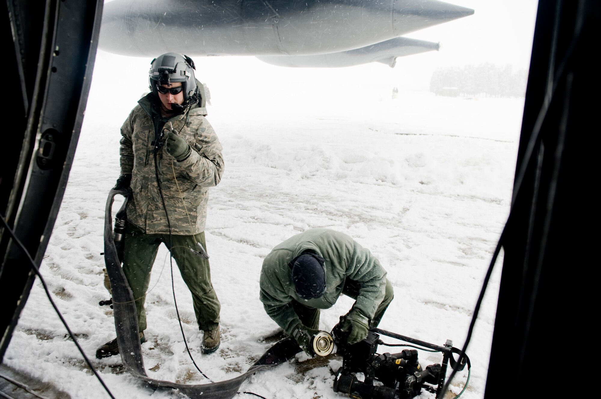 Staff Sgt. Nicholas Wisnoski and Tech. Sgt. Timothy Rodgers setup equipment to defuel an MC-130P Combat Shadow March 17, 2011, at Yamagata Airport, Japan, during efforts to establish a forward area refueling point there. FARPs allow aircraft to operate at further distances by allowing the aircraft to refuel where no fuel typically exists. The fuel at Yamagata Airport will be used for American search-and-recovery teams during Japan's earthquake and tsunami relief.  Sergeant Wisnoski is with the 17th Special Operations Squadron at Kadena Air Base, Japan. Sergeant Rogers is with the 353rd Special Operations Group at Kadena AB. (U.S. Air Force photo/ Staff Sgt. Jonathan Steffen) 