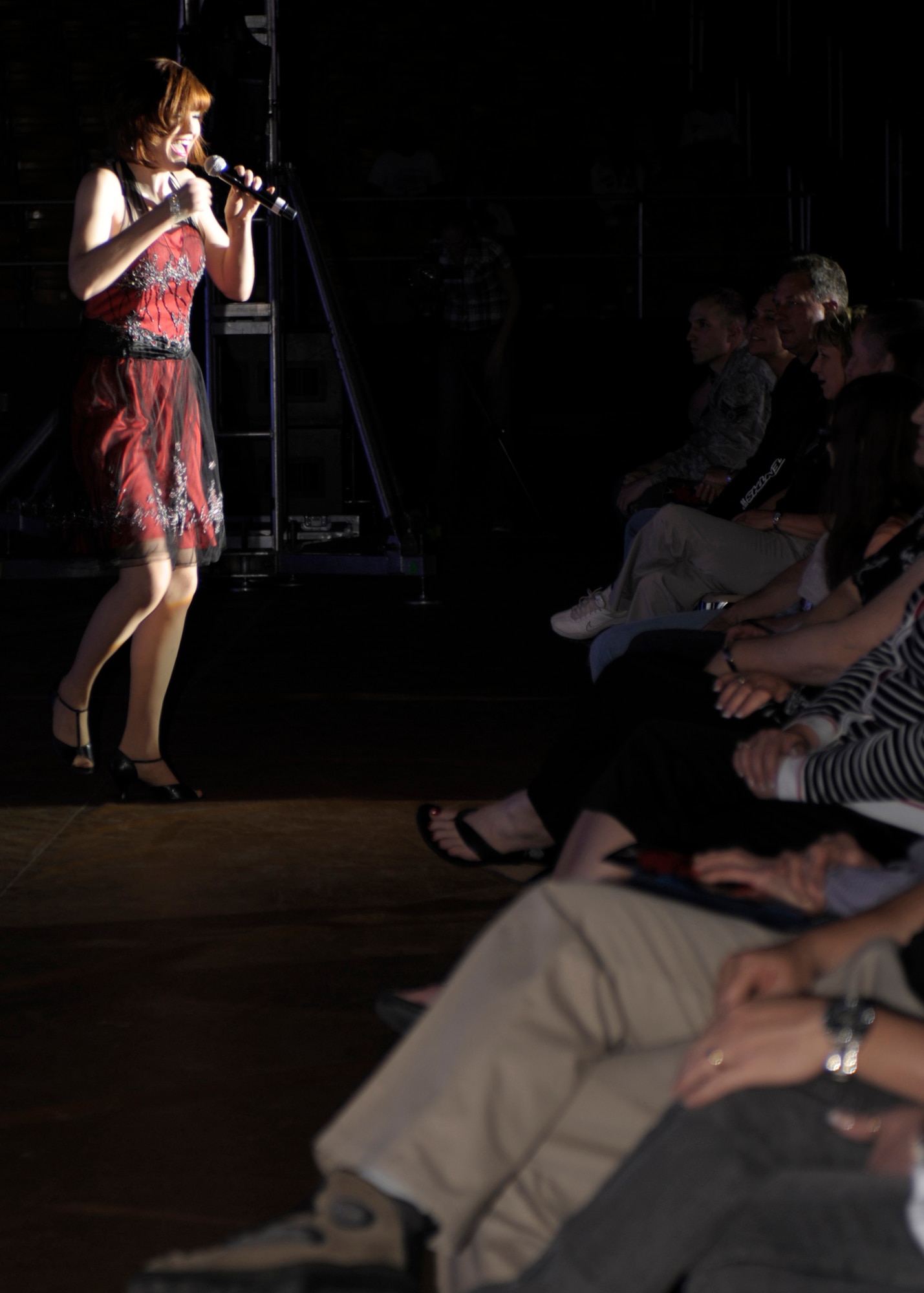 Airman 1st Class Jette Warnick, 27th SOW Special Operations Wing, Cannon Air Force Base, N.M.,  performs a solo during an Air Force Tops in Blue show at the Greyhound Arena in Portales, N.M., March 16, 2011. Tops in Blue is a permier group of  entertainers who  perform for communities throughout the world. (U.S. Air Force photo by Airman Ericka Engblom)