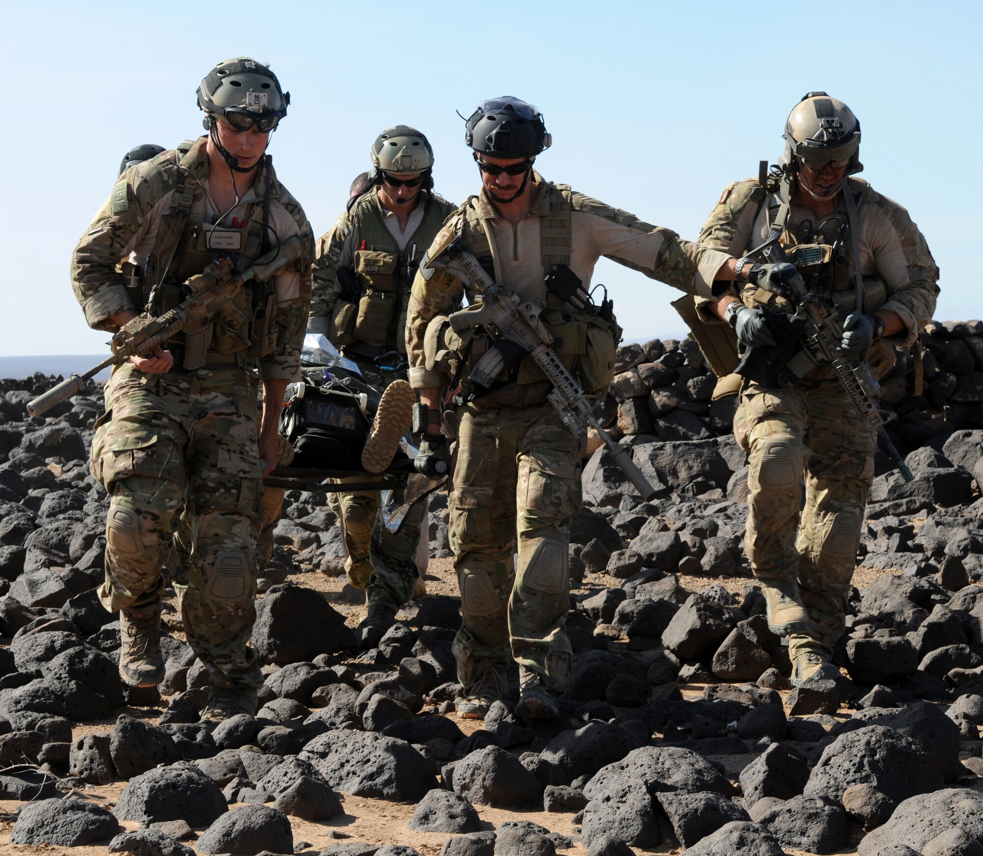 DJIBOUTI--Air Force Pararescuemen from the 81st Expeditionary Rescue Squadron extract the victim from the site of a simulated plane crash near Djibouti during a rescue exercise Feb. 26. A personnel recovery task force of pararescuemen and an Army site security team responded to a call from the downed aircrew, rescued two survivors, and returned them to safety. (U.S. Air Force photo/Staff Sgt. Austin M. May)

 
