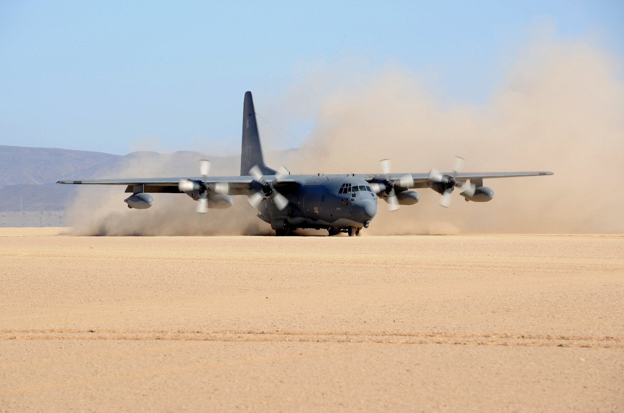 DJIBOUTI-- An HC-130P from the 81st Expeditionary Rescue Squadron taxis on a dry lakebed near Djibouti during a simulated rescue exercise Feb. 26. The exercise scenario consisted of a personnel recovery task Force of pararescuemen and an Army site security team responding to a downed aircrew, extracting two survivors, and returning them to safety (U.S. Air Force photo/Master Sgt. Dawn M. Price)
