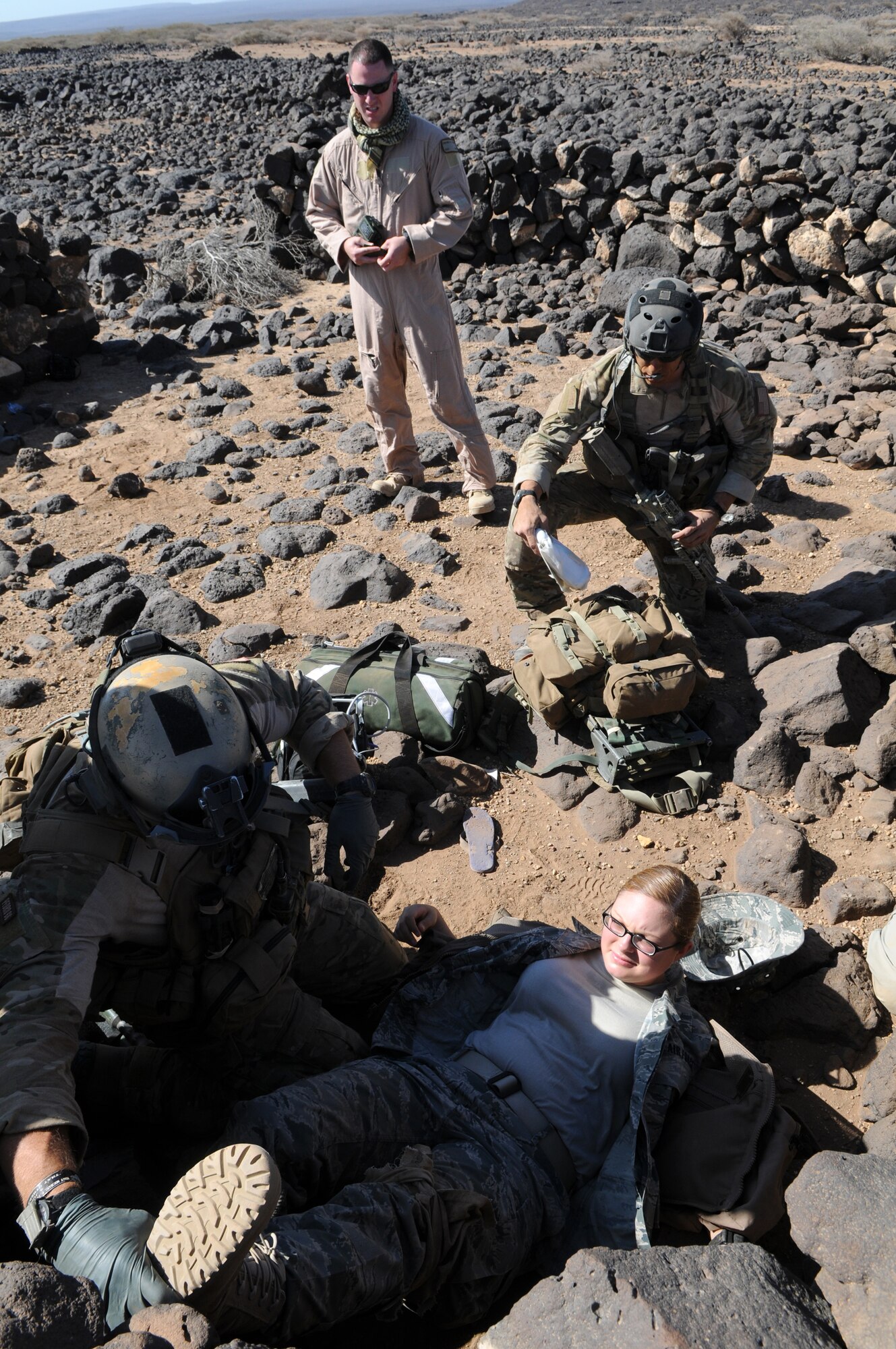DJIBOUTI--Air Force Pararescuemen from the 81st Expeditionary Rescue Squadron tend to the victim of a simulated plane crash near Djibouti during a rescue exercise Feb. 26. A personnel recovery task Force of pararescuemen and an Army site security team responded to a call from the downed aircrew, extracted two survivors, and returned them to safety. (U.S. Air Force photo/Staff Sgt. Austin M. May)
