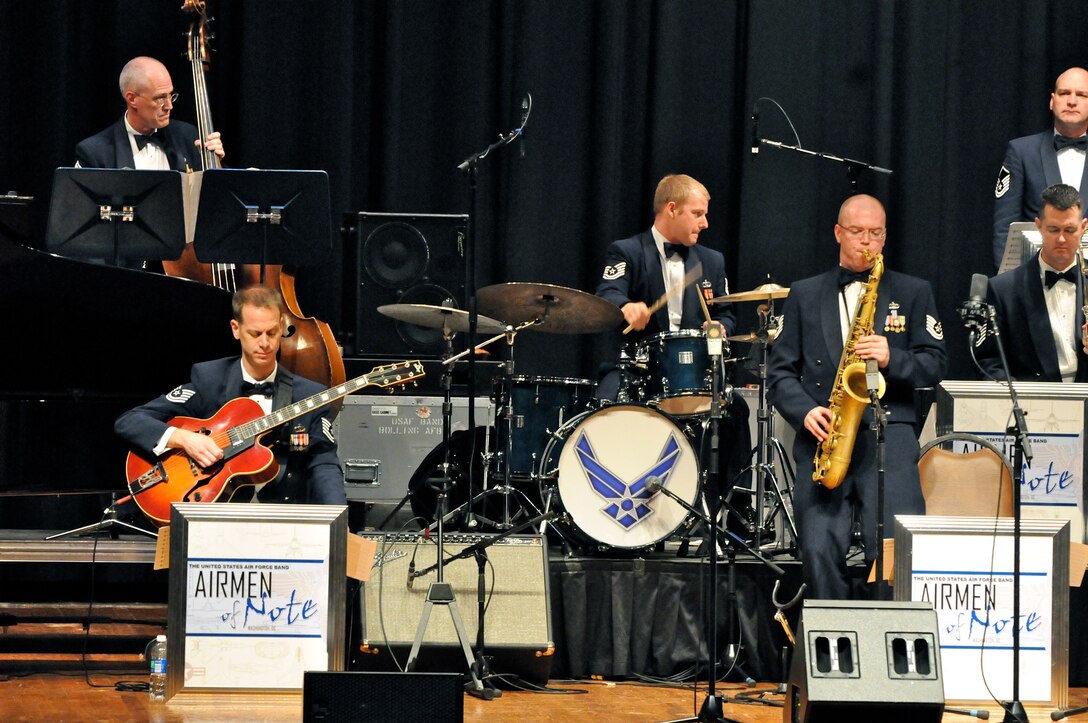 Tech. Sgt. Tedd Baker, lead tenor saxophonist with the U.S. Air Force Band Airmen of Note, solos March 16 at Bassett High School, Bassett, Va. The Note is traveling through Virginia, Tennessee, Mississippi and Arkansas on it's 2011 Spring Tour. (U.S. Air Force photo by Airman 1st Class Tabitha N. Haynes)