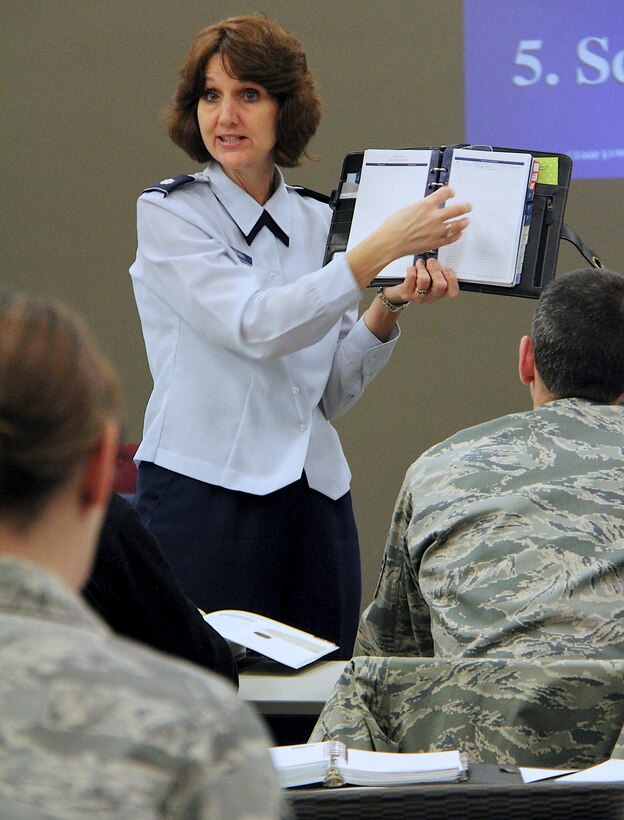 932nd Airlift Wing members listen to Lt. Col. Stephanie Boehning discuss organization and planning during a professional development course held Mar.14, 2011 in the wing conference room on Scott Air Force Base. The one-day class provides attendees with a daily planner and instruction on ways to improve time management skills.  (U.S. Air Force photo/Tech. Sgt. Christopher Parr)