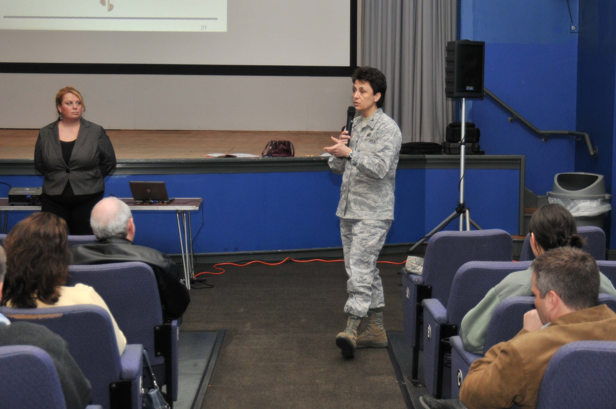 ROYAL AIR FORCE LAKENHEATH, England - Col. Cassie Barlow, 48th Mission Support Group commander, speaks to U.S. federal employees at a town hall meeting in the RAF Lakenheath theater March 18. The meeting was held to discuss a possible furlough of federal employees in the event of a budget expiration. (U.S. Air Force photo/Senior Airman David Dobrydney)