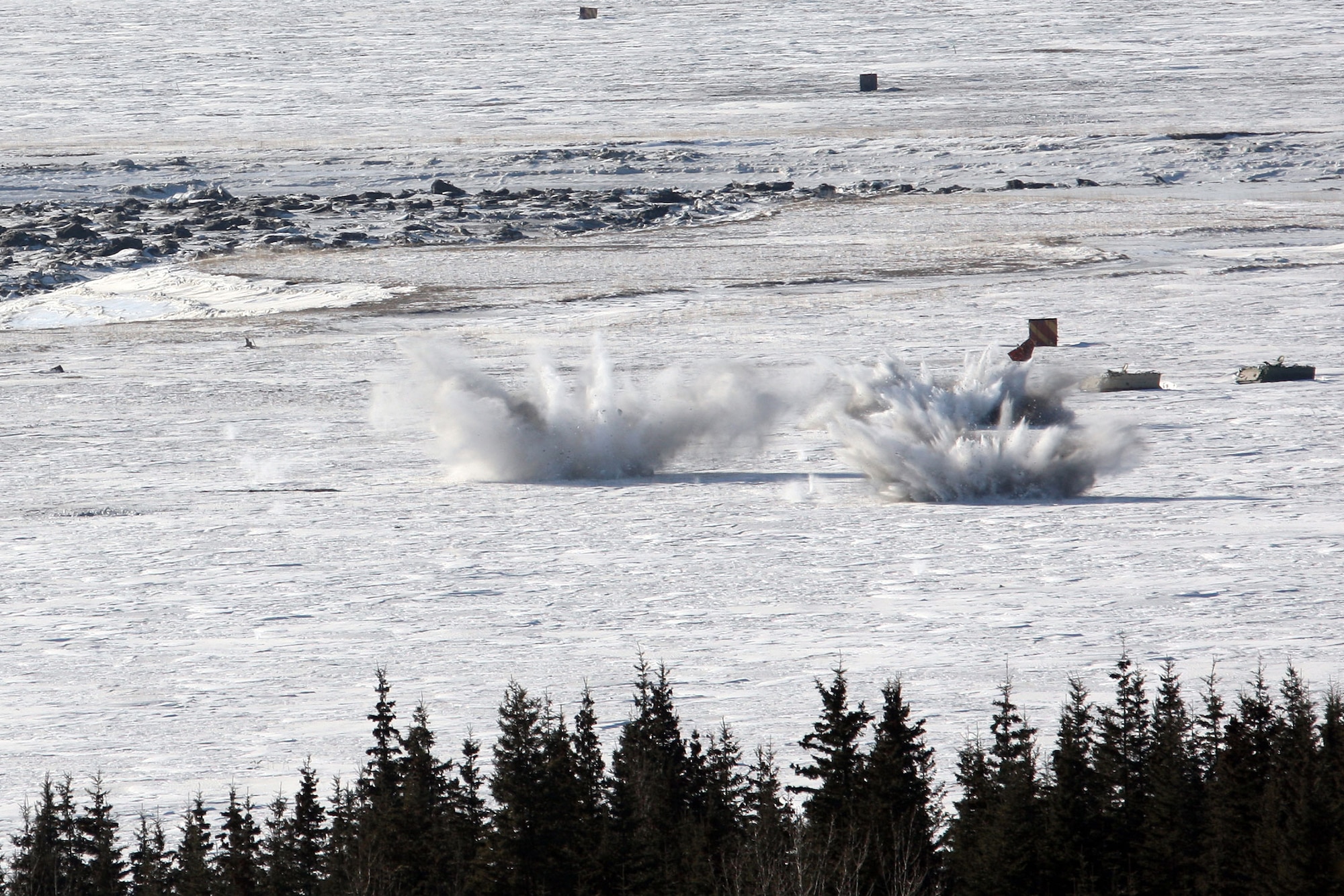 Artillery rounds rain down on an impact zone as A Battery, 2nd Battalion, 377th Parachute Field Artillery Regiment, fires M119A1 105-mm howitzer shells, March 10. (U.S. Air Force photo/Percy Jones)