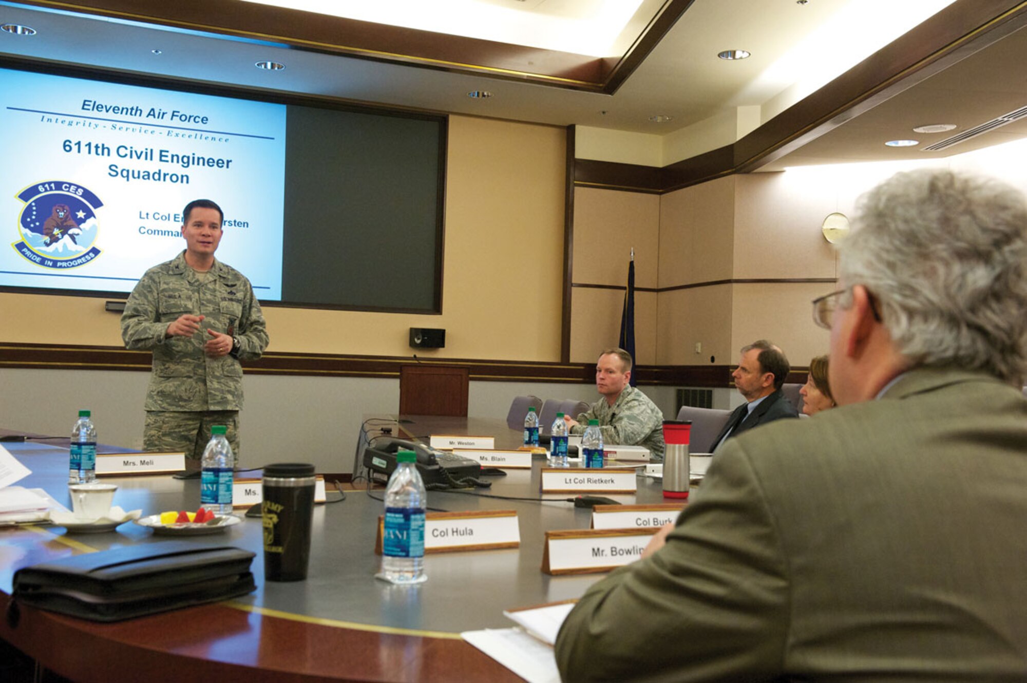 Air Force Col. Russell Hula, 673d Civil Engineer Group commander, addresses questions from Curtis Bowling, director, Environment Readiness and Safety, Office of the Secretary of Defense, March 10, at Alaskan Command Headquarters. Bowling headed a U.S. – Australian delegation to address environmental issues and share best practices. (U.S. Air Force photo/David Bedard)