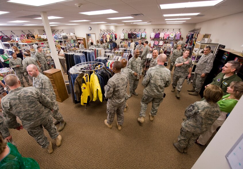 Attendees of the reopening ceremony for the Airman's Attic mingle and explore the new facility on Barksdale Air Force Base, La., March 17. The Airman's Attic is now located in the old clothing sales building located on the corner of Wilbur Wright Road and Kenney Avenue. (U.S. Air Force photo/Senior Airman Chad Warren)(RELEASED)