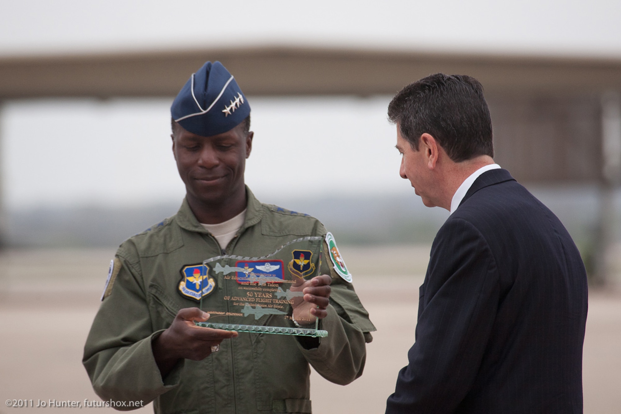 Gen. Edward A. Rice Jr. receives a commemorative plaque from Tony Imondi, a Northrop Grumman official, March 17, 2011, at Randolph Air Force Base, Texas. The plaque commemorates 50 years of advanced flight training aboard the Northrop-built T-38 Talon. General Rice is the commander of Air Education and Training Command. (Courtesy photo/Jo Hunter)