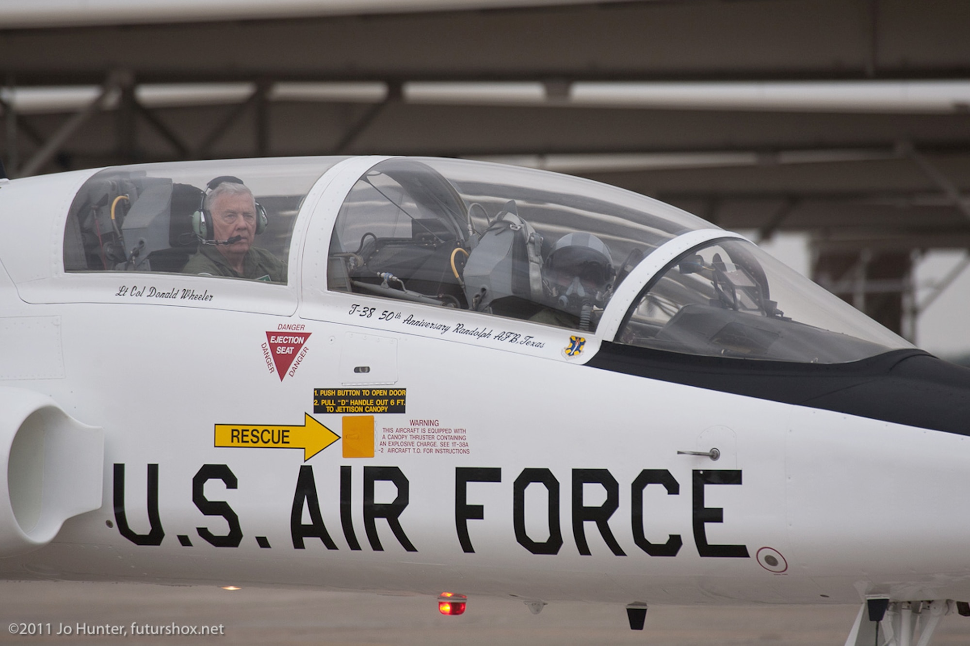 Retired Lt. Col. Donald Wheeler (left) rides in the rear seat of a T-38 Talon, as it comes to a stop March 17, 2011, on the flightline at Randolph Air Force Base, Texas. This T-38 has been painted with a special commemorative color scheme, giving the plane an appearance similar to its original 1961 look. Colonel Wheeler was a member of the first class of pilots to train on the T-38. He graduated in 1962. (Courtesy photo/Jo Hunter)