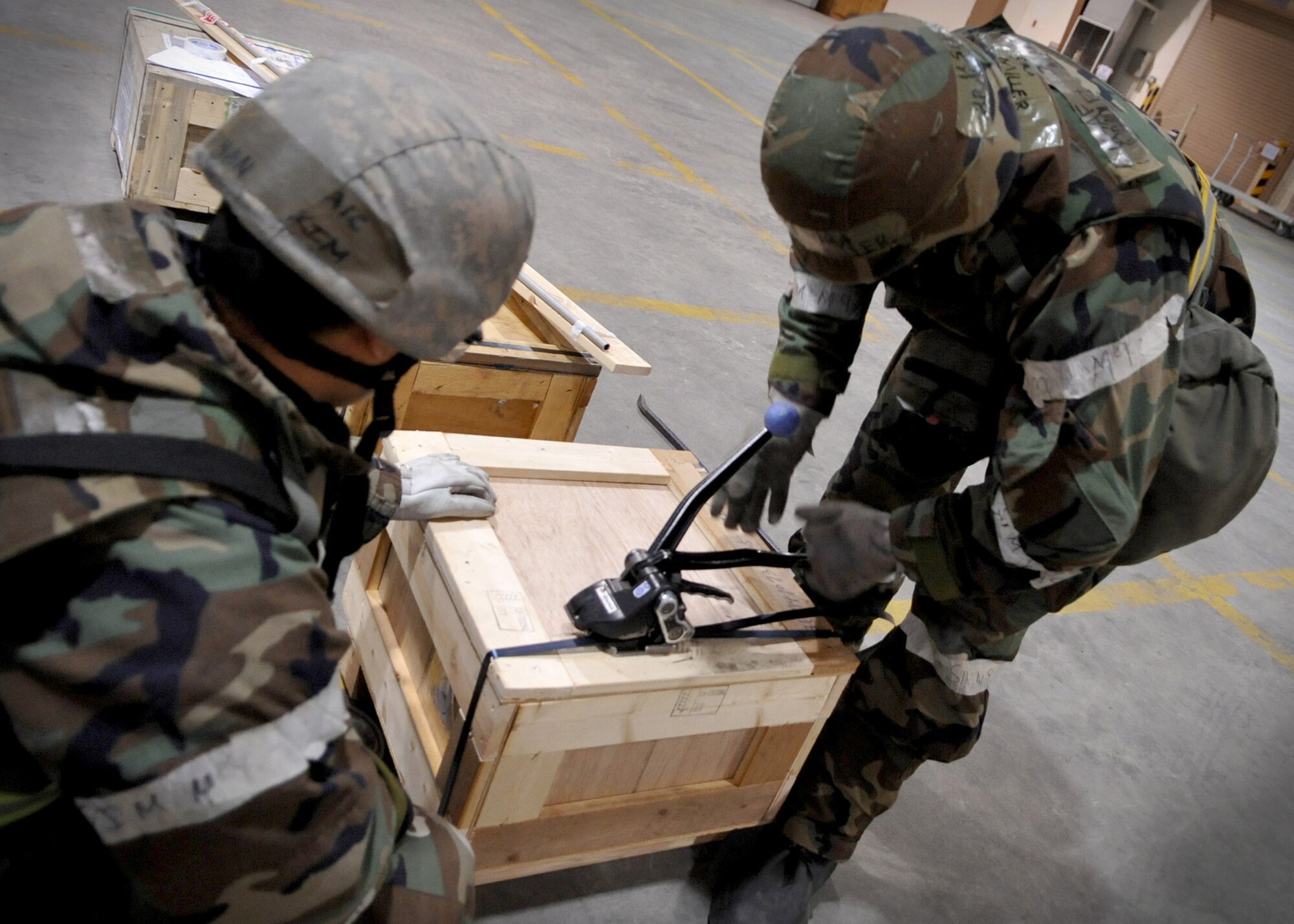 Airmen from 51st Logistics Readiness Squadron processed 18,000 pounds of cargo March 14, 2011, at Osan Air Base, South Korea, in support of Operation Tomodachi. The supplies were being transported to the Ronald Reagan Carrier Group to continue humanitarian-aid missions off the east coast of Honshu, Japan. (U.S. Air Force photo/Senior Airman Evelyn Chavez)