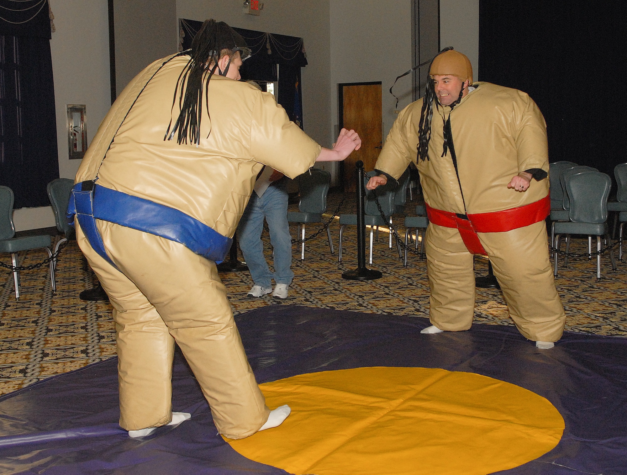 Chief Master Sgt. Joe Riff (Right), 436th Mission Support Group, and Airman 1st Class Benjamin Bisel, 436th Logistics Readiness Squadron, face off at the sumo-wrestling tournament March 16, 2011, at The Landings Club at Dover Air Force Base, Del. The event, sponsored by the Community Activities Center, pitted Airmen from various squadrons against each other in a single-elimination showdown. Master Sgt. Brian Hierl, 436th Force Support Squadron, defeated Chief Riff in the final round to take top prize.     