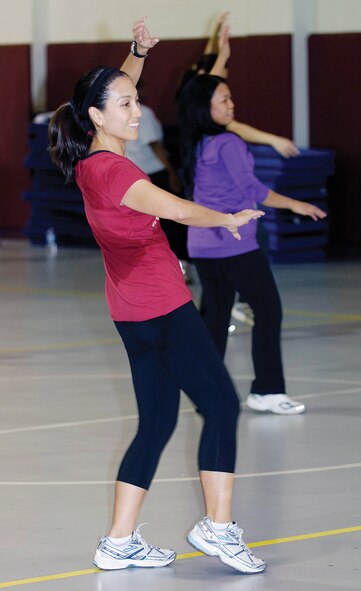 The high-energy Zumba exercise class at the Gerrity Fitness Center attracts people in all stages of fitness for an hour of upbeat music and constant motion. Approximately 34 people, including Angela Perez-Castle, 38th Cyberspace Engineering Group, attended the March 7 class. (Air Force photo by Margo Wright)