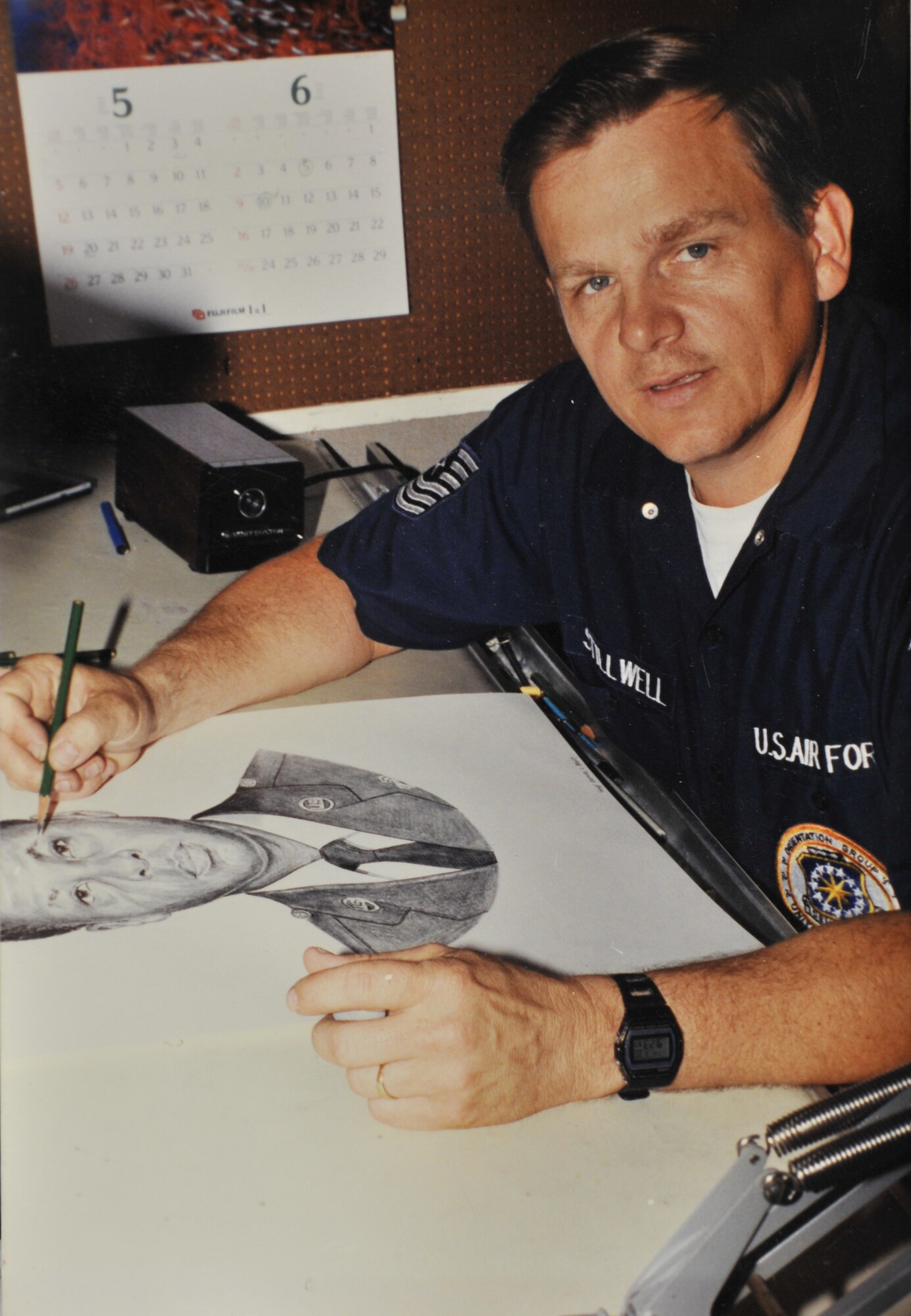 Then-Master Sgt. Stillwell finishes a portrait for Airman Magazine in 1990.  Mr. Stillwell's art can be seen in numerous places in Malmstrom's Building 500.  (Courtesy Photo)